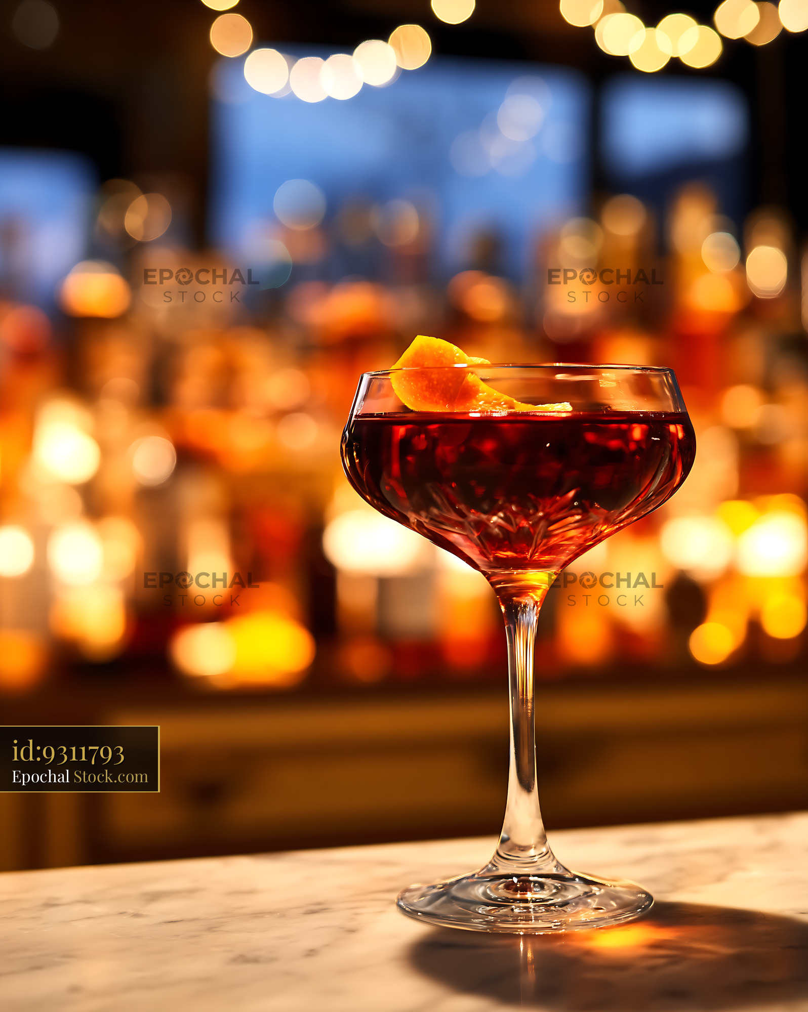 Bushwick Cocktail in Coupe Glass with Bar Ambiance - stock photo