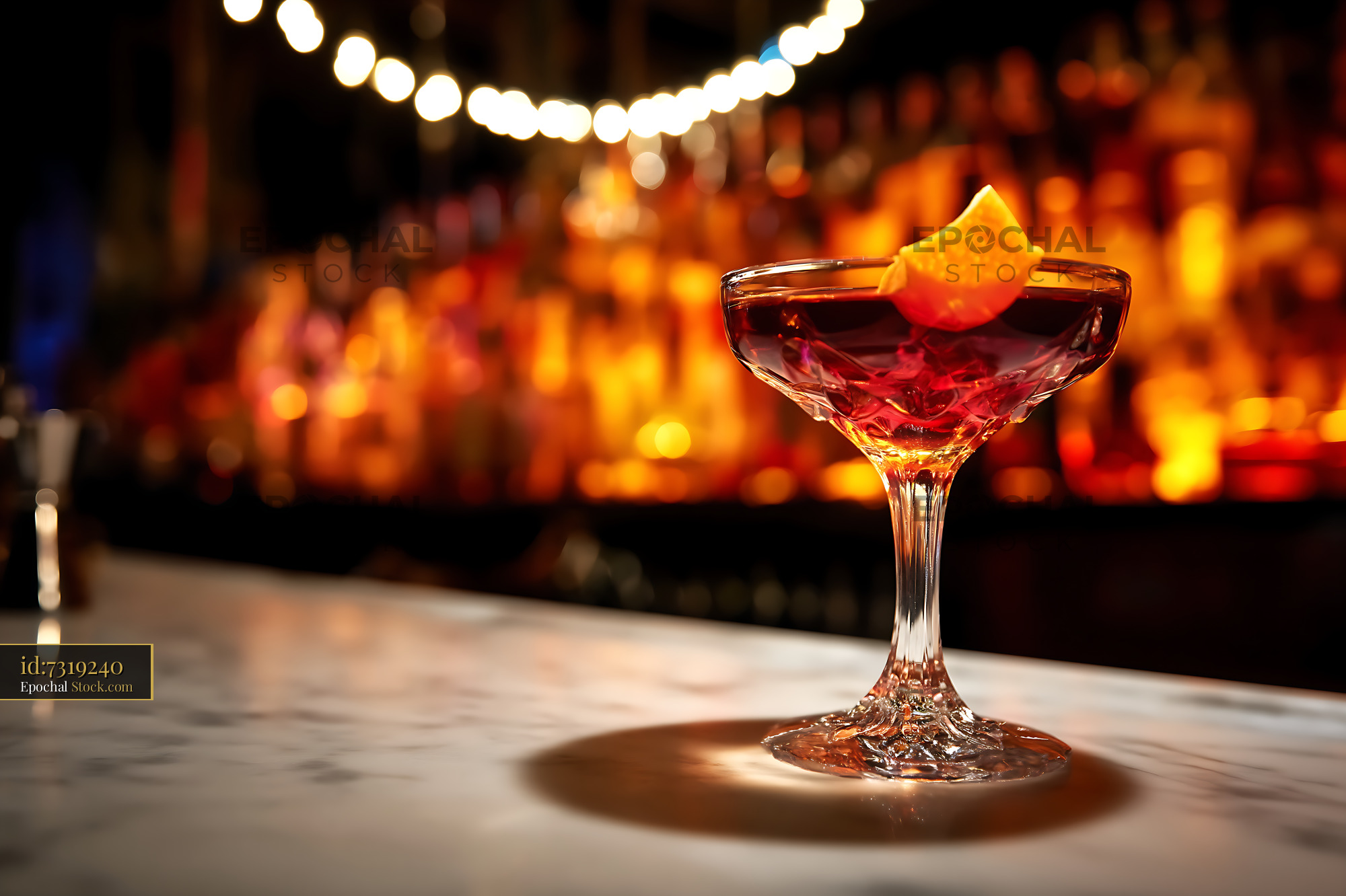 Bushwick Cocktail with Orange Twist at Bar - stock photo