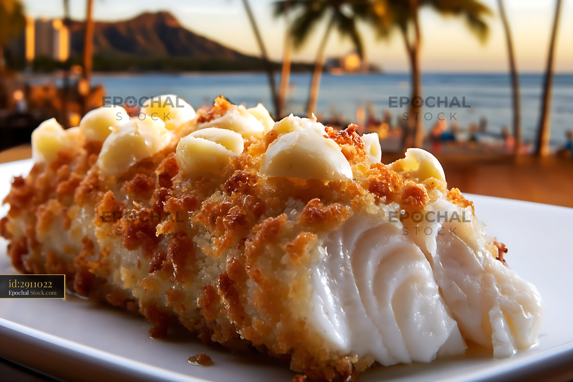 Coconut Cake Slice at Hawaiian Beach at Sunset - stock photo