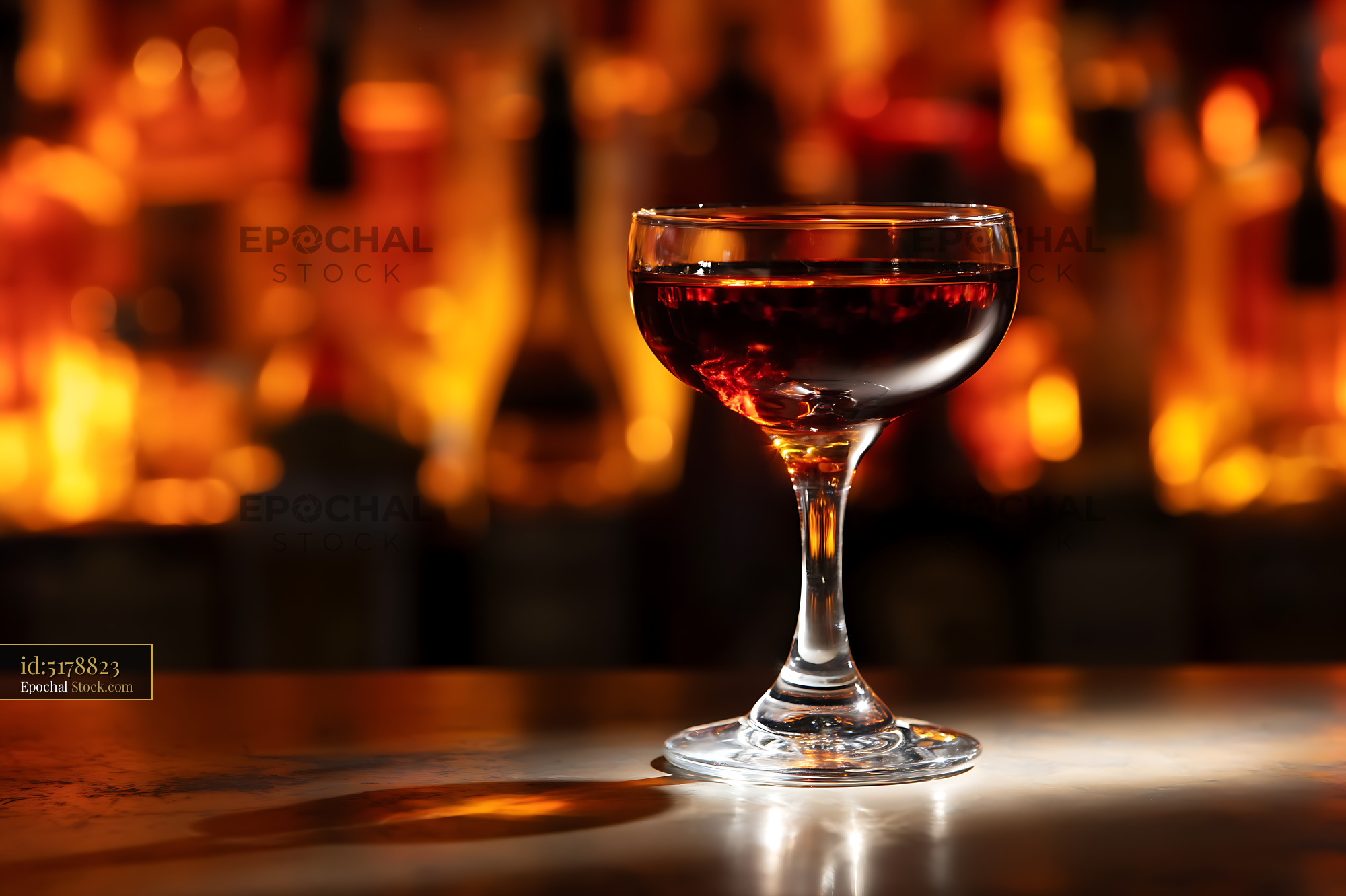 Bushwick Cocktail in Coupe Glass with Firelight - stock photo