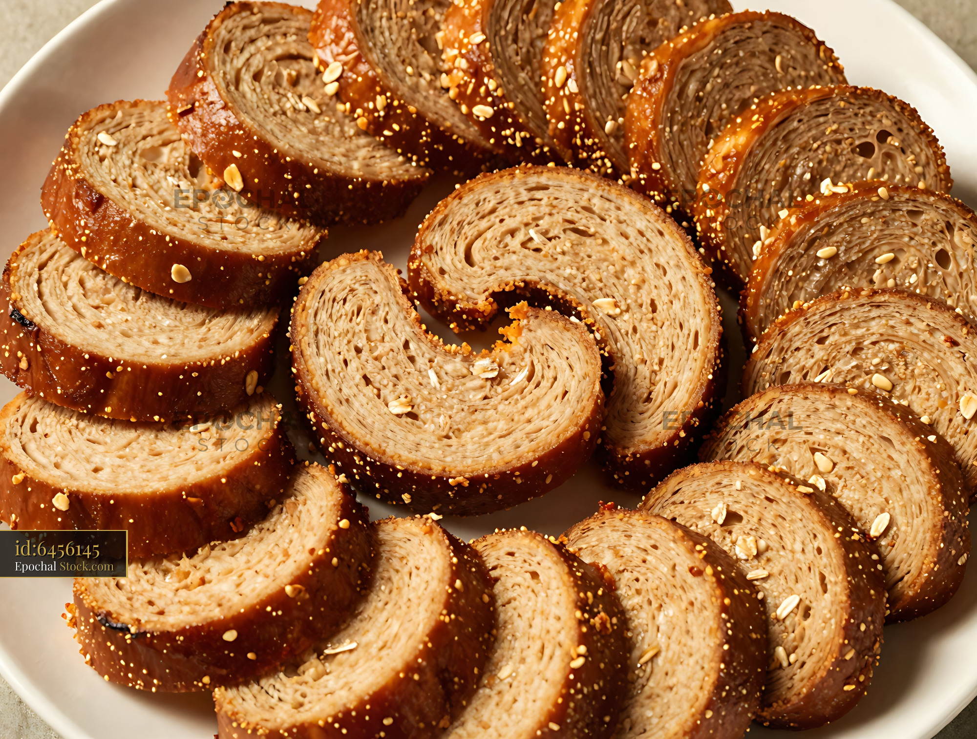 Artisanal Whole Grain Spiral Bread Slices - stock photo