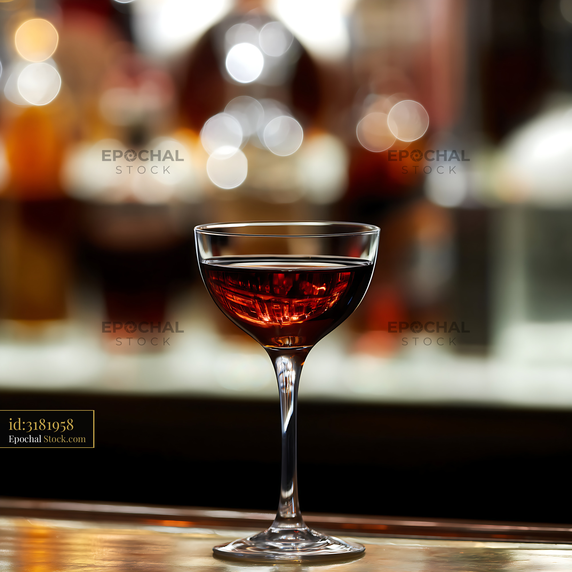 Bushwick Cocktail in Coupe Glass at Bar - stock photo