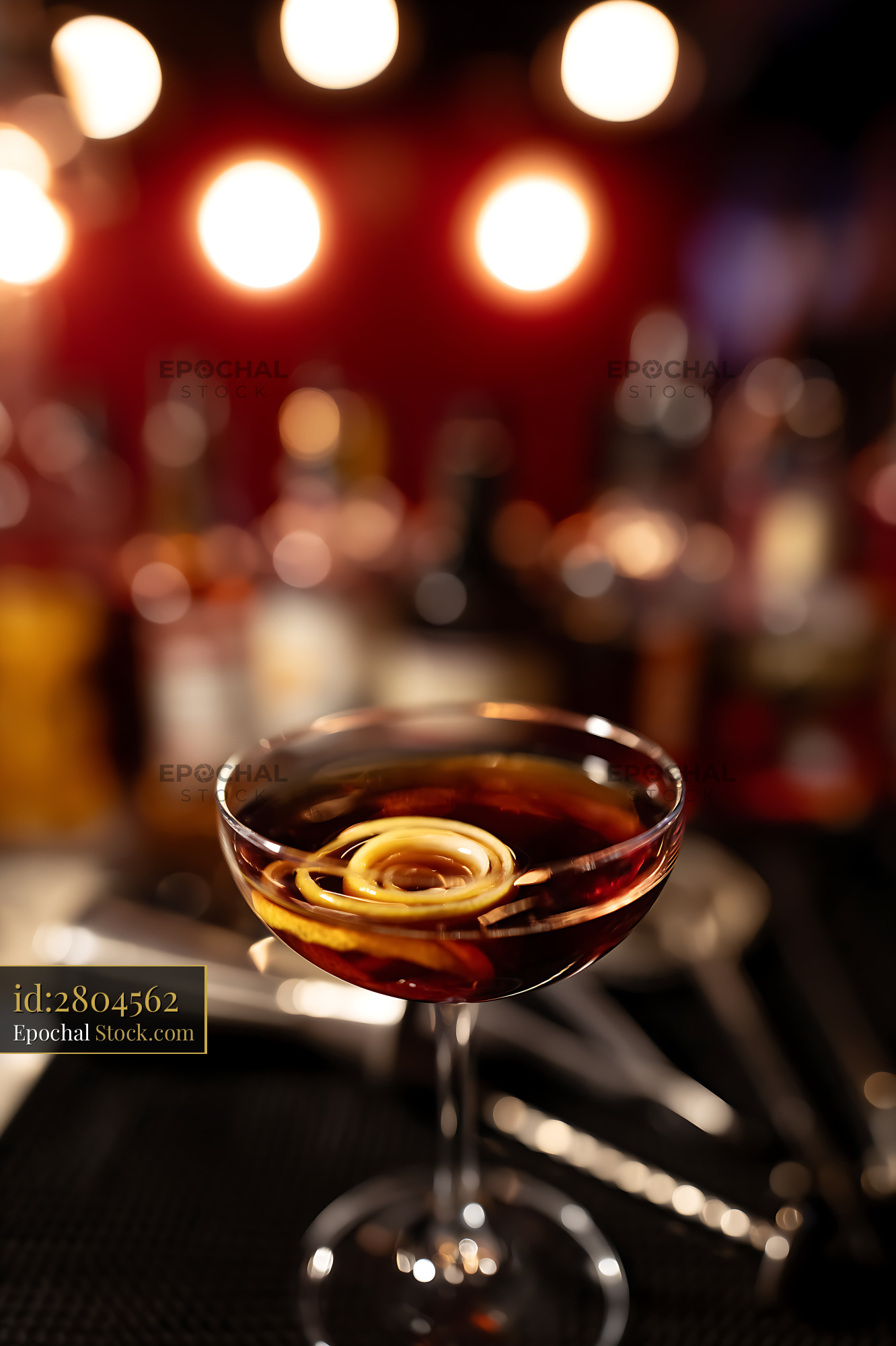 Bushwick Cocktail with Lemon Twist at Bar - stock photo