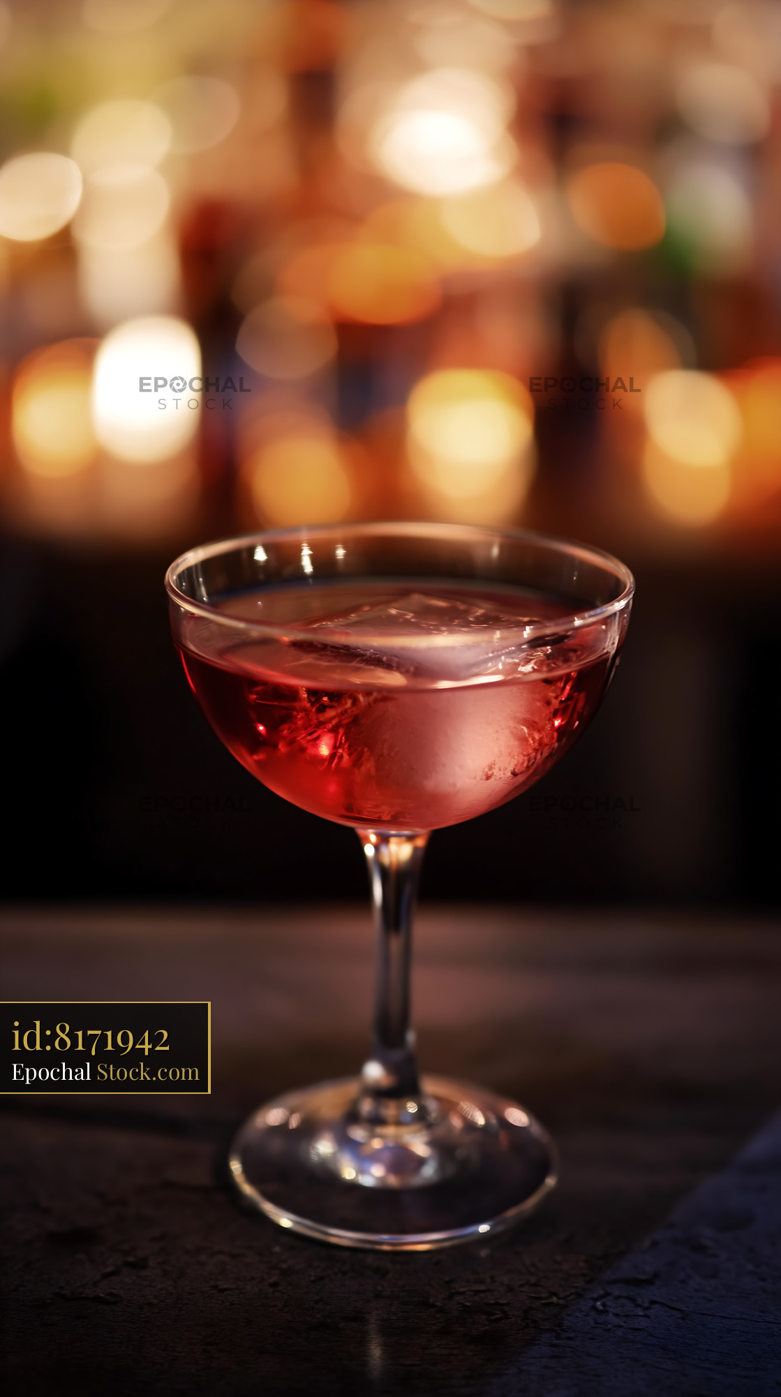 Red Cocktail with Ice in Elegant Coupe Glass - stock photo