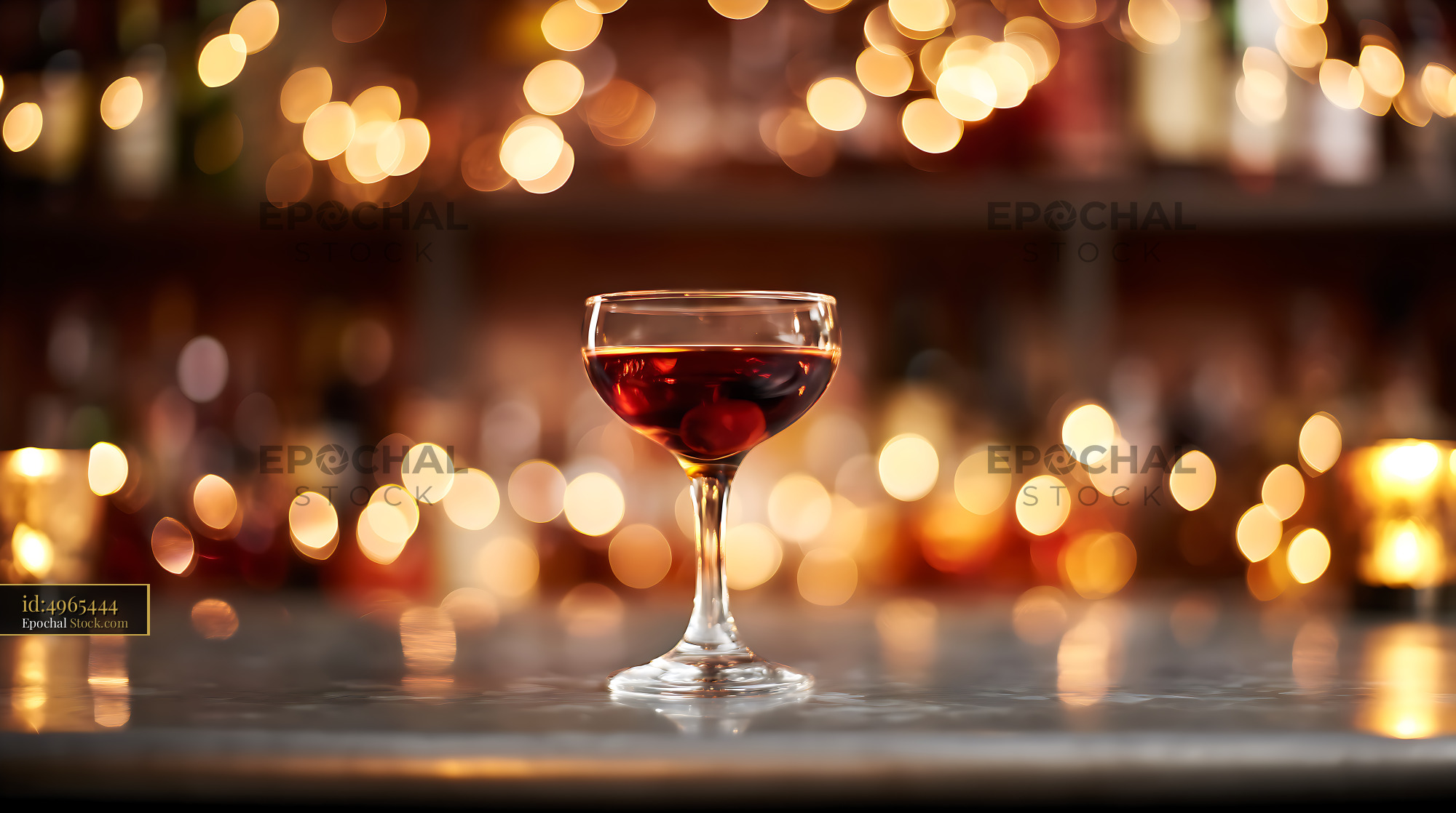 Elegant Red Cocktail Coupe Glass at Bar - stock photo