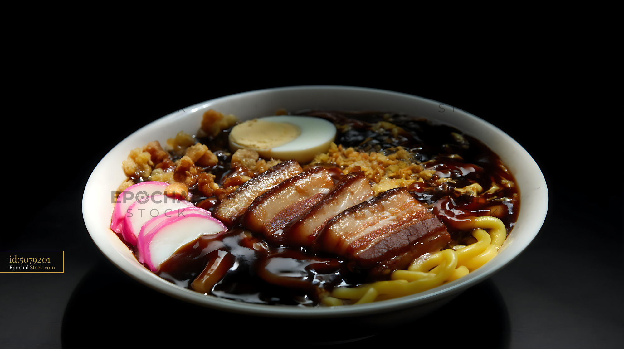 Hearty Lor Mee Soup with Pork Belly, Egg, and Fish Cake - stock photo