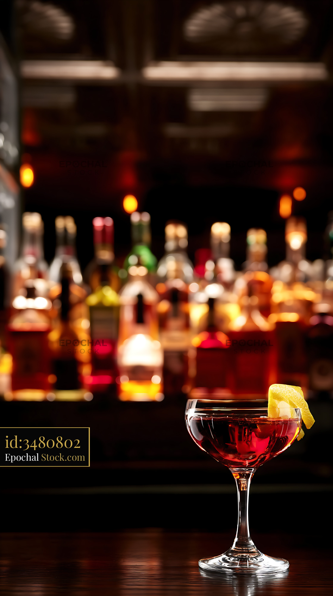 Bushwick Cocktail with Lemon Twist at Bar - stock photo