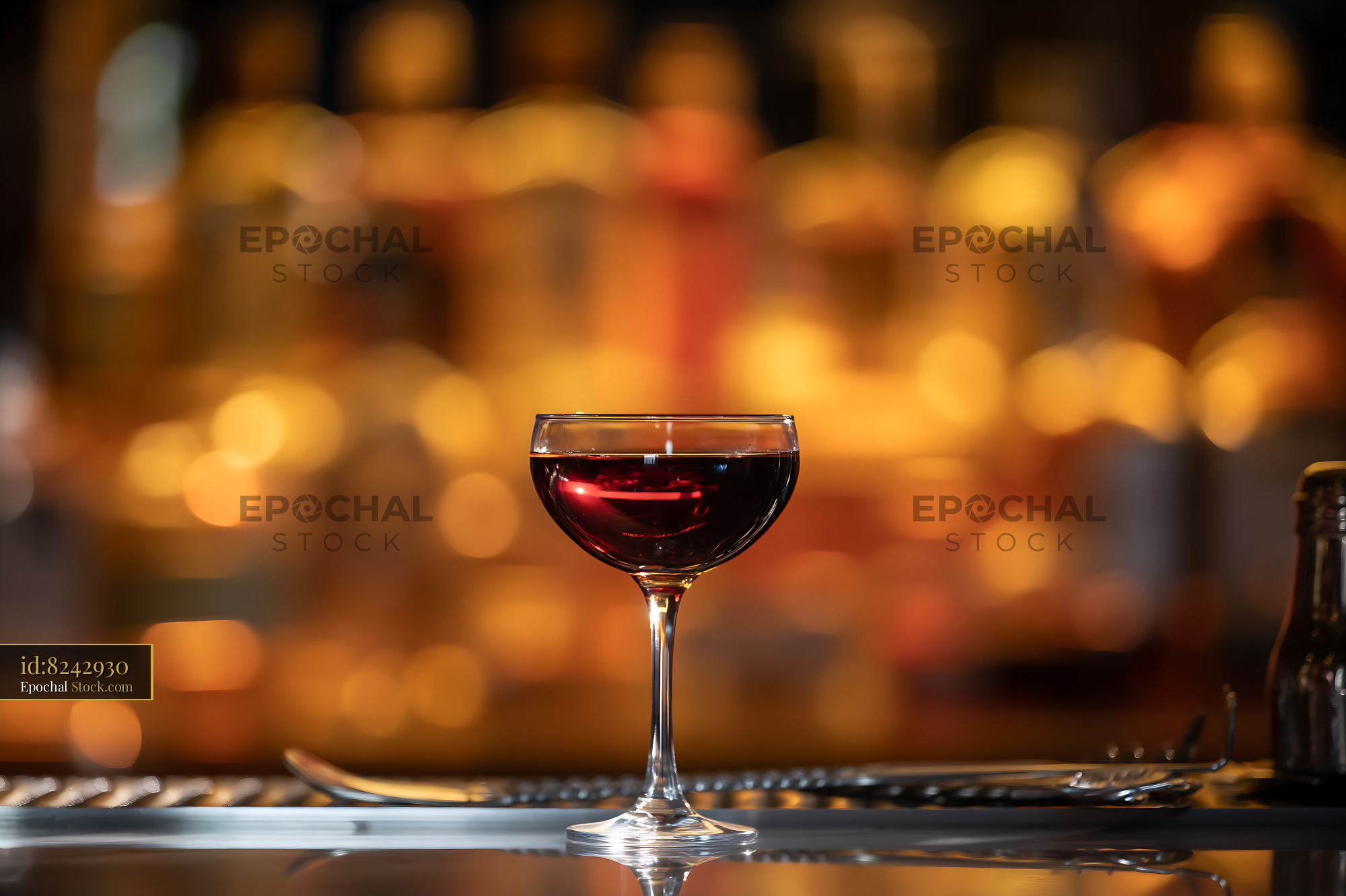 Bushwick Cocktail in Coupe Glass at Bar - stock photo