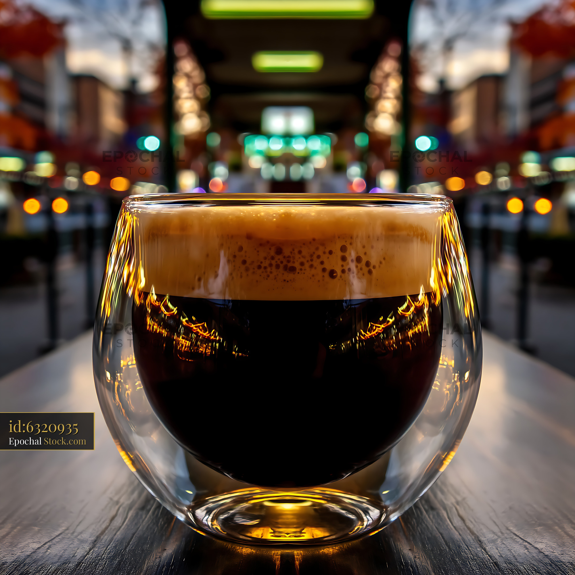 Nitro Caramel Coffee in Double-Walled Glass - stock photo