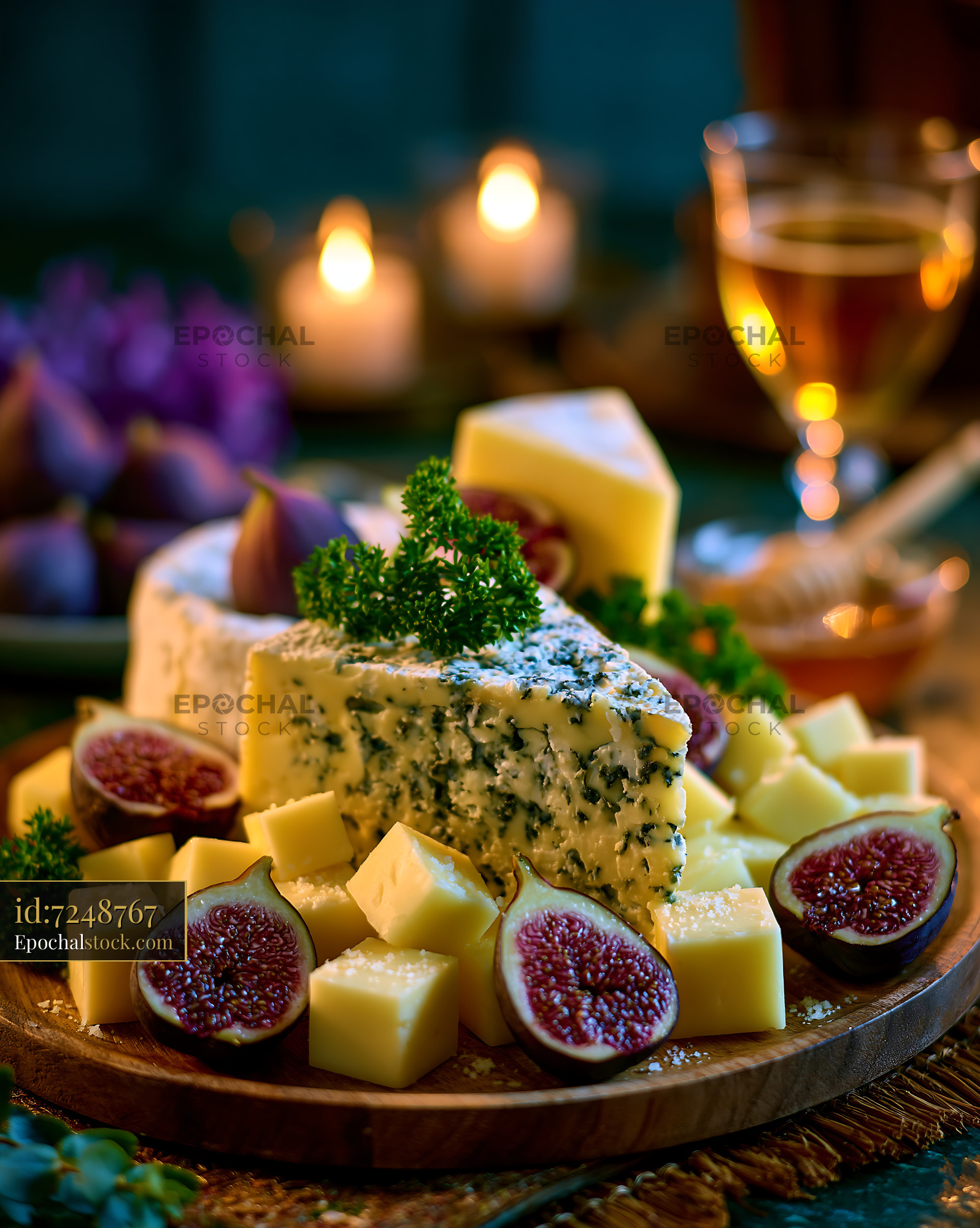 Watermarked full-resolution preview of Cheese platter with figs and wine on a table with candles