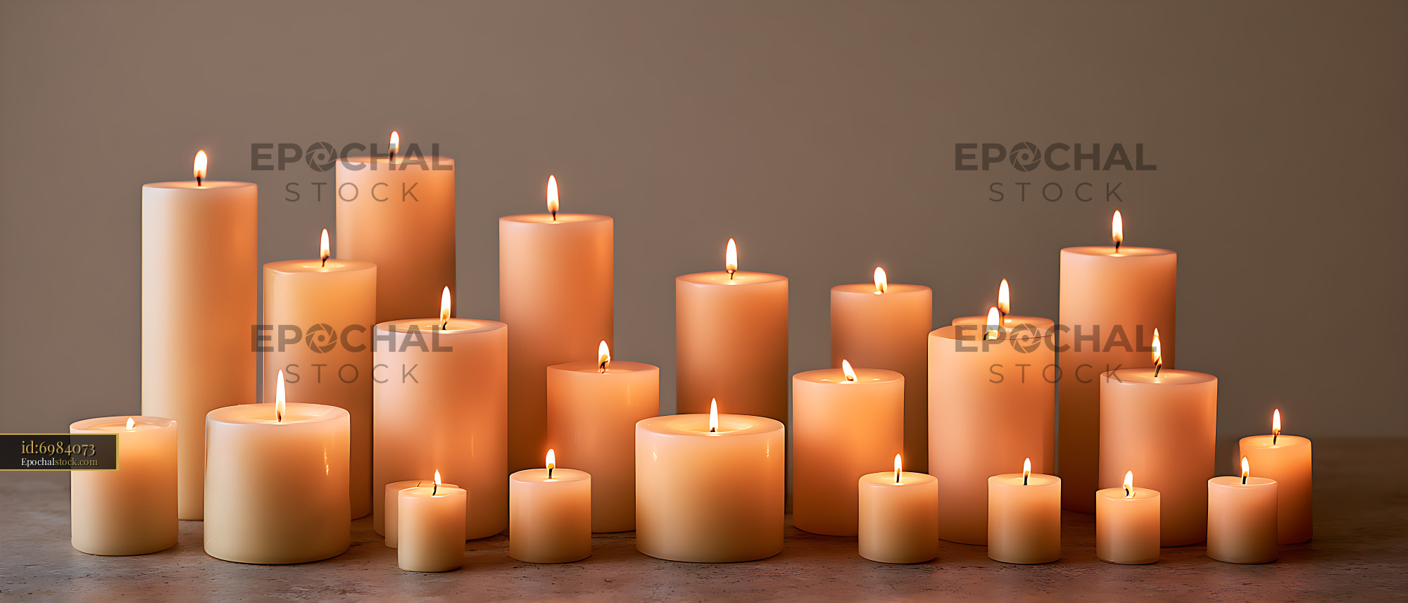 Watermarked full-resolution preview of Glowing pillar candles arranged in varied heights
