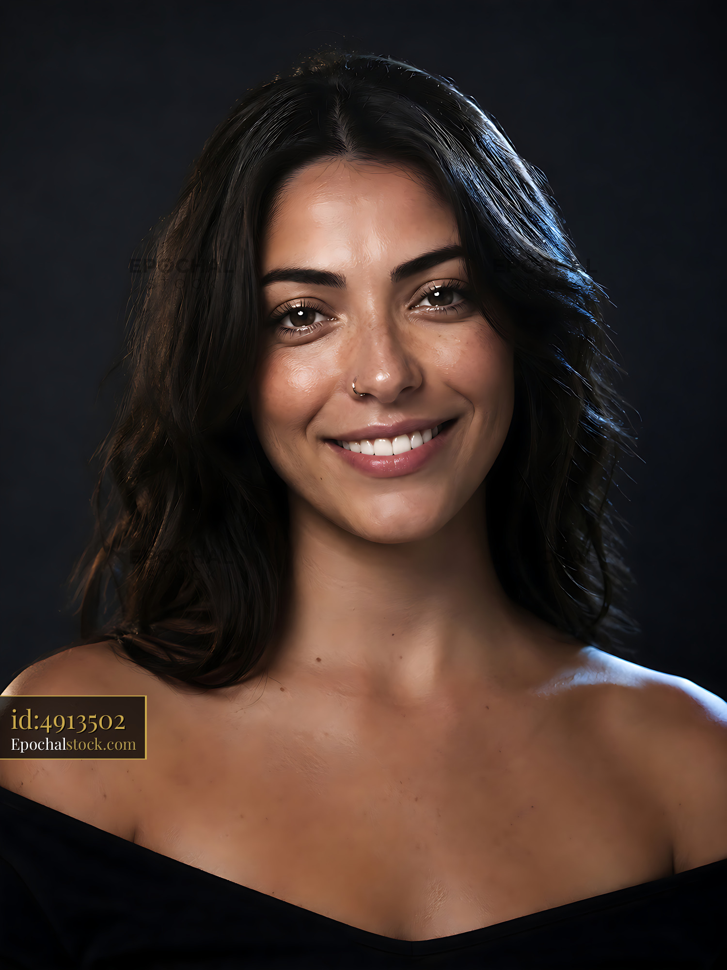 Watermarked full-resolution preview of Portrait of a woman smiling with soft lighting