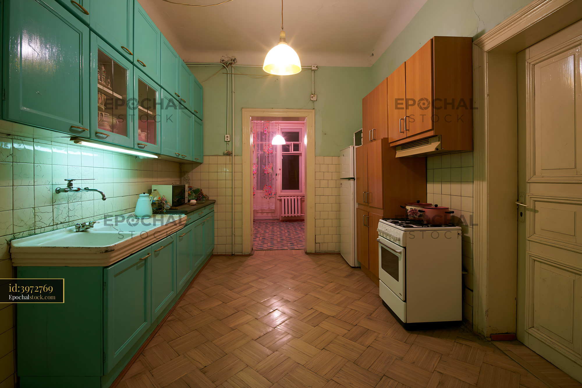 Watermarked full-resolution preview of Kitchen with teal cabinets and wooden floors in a vintage apartment