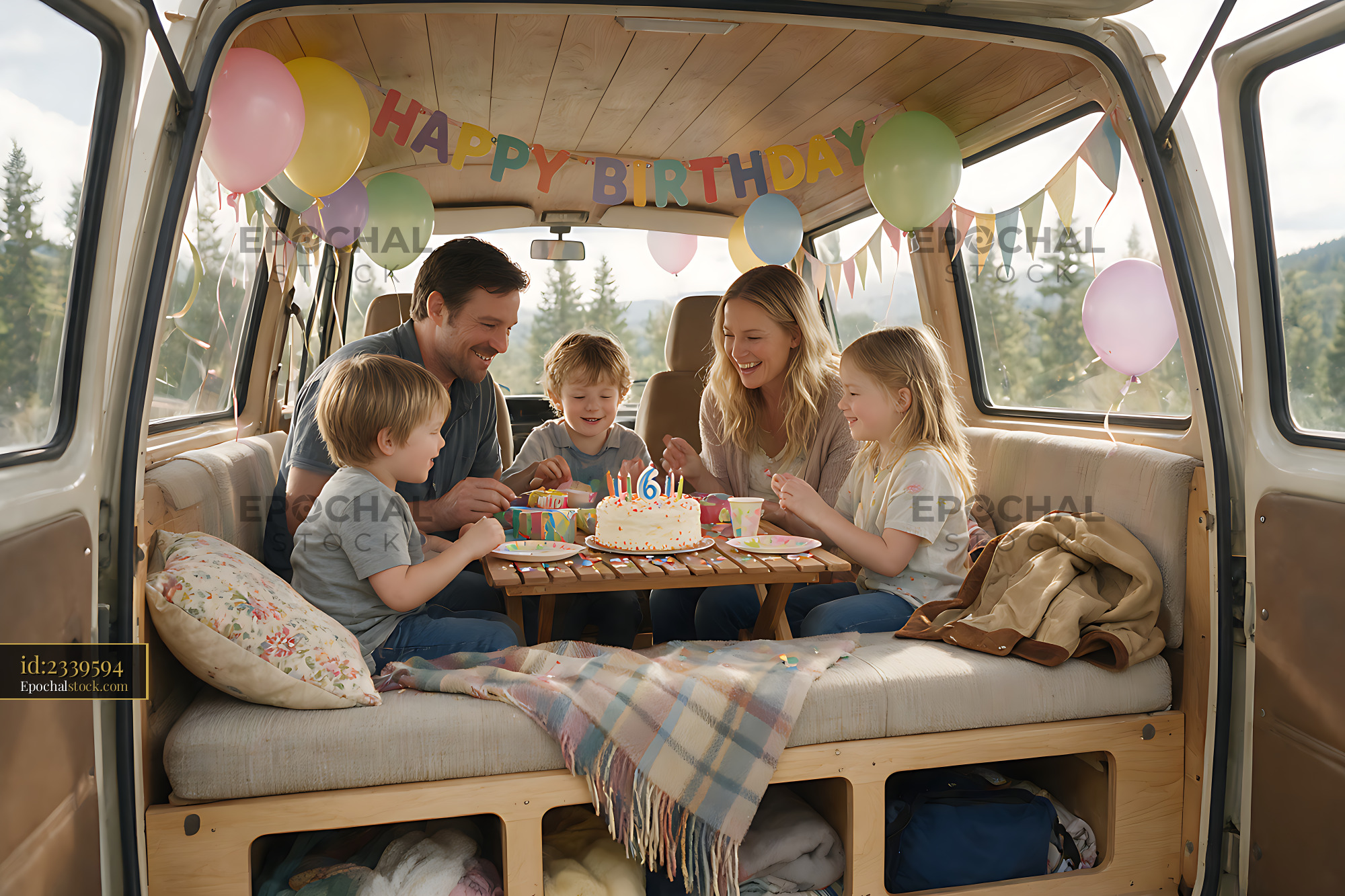 Watermarked full-resolution preview of Family birthday celebration in a decorated camper van