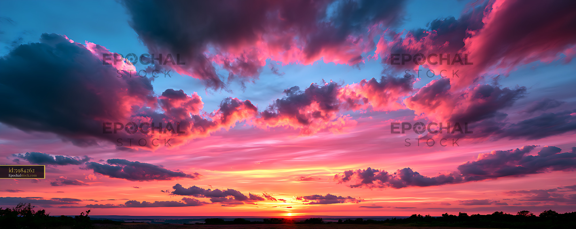 Watermarked full-resolution preview of Colorful sunset cloudscape above a rural horizon