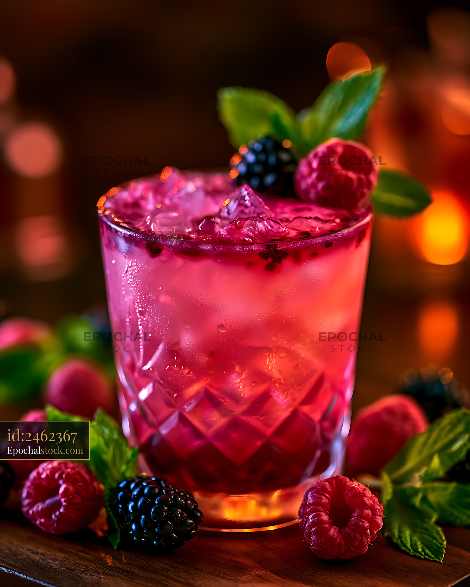 Watermarked full-resolution preview of Pink berry drink garnished with raspberries and mint