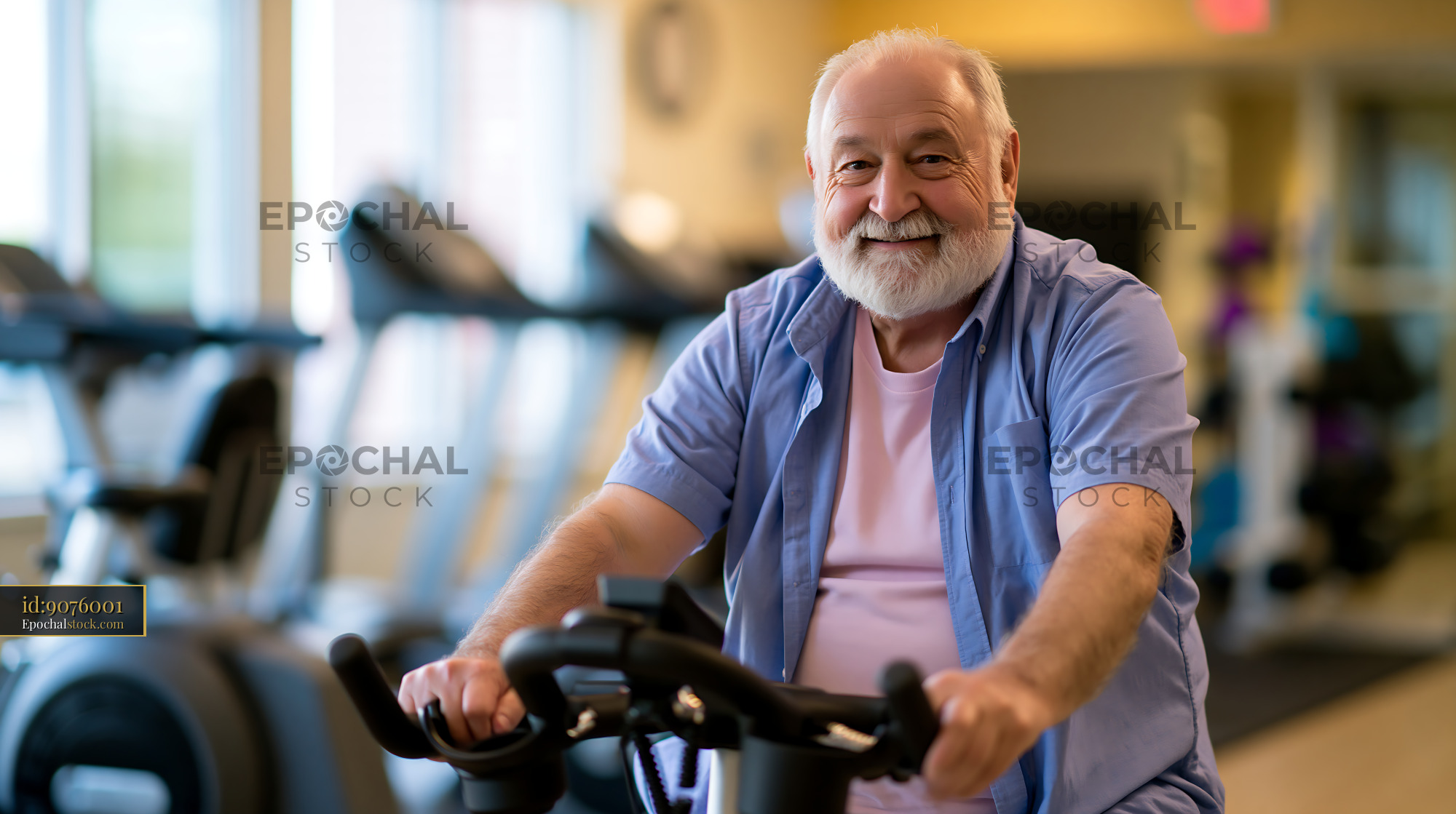 Watermarked full-resolution preview of Senior man exercising on stationary bike in fitness center