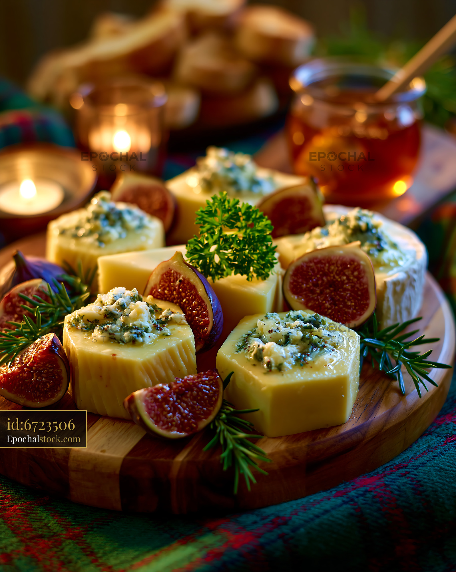 Watermarked full-resolution preview of Gourmet cheese platter with figs and warm candlelight