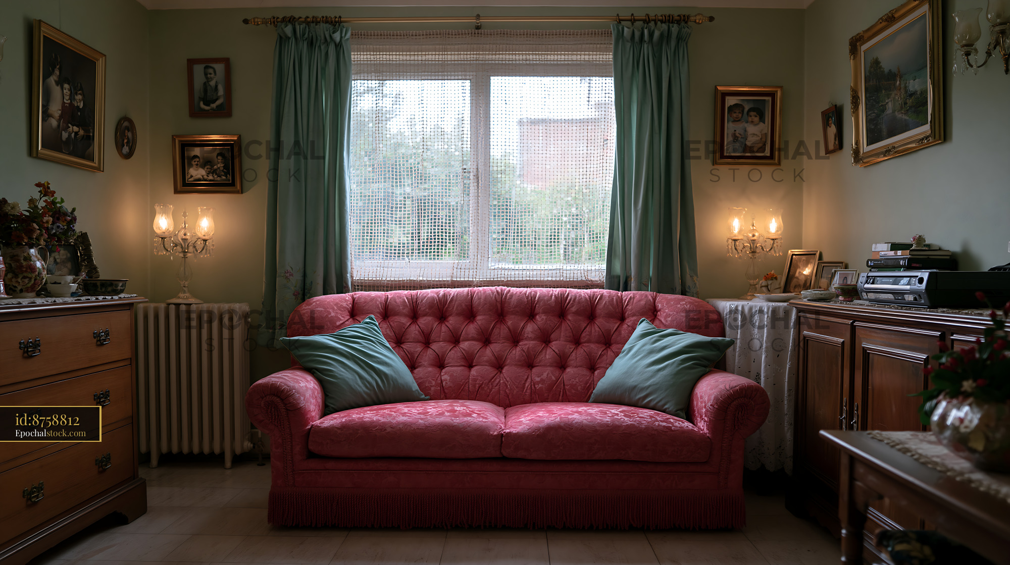 Watermarked full-resolution preview of Cozy living room with a pink sofa and family photographs