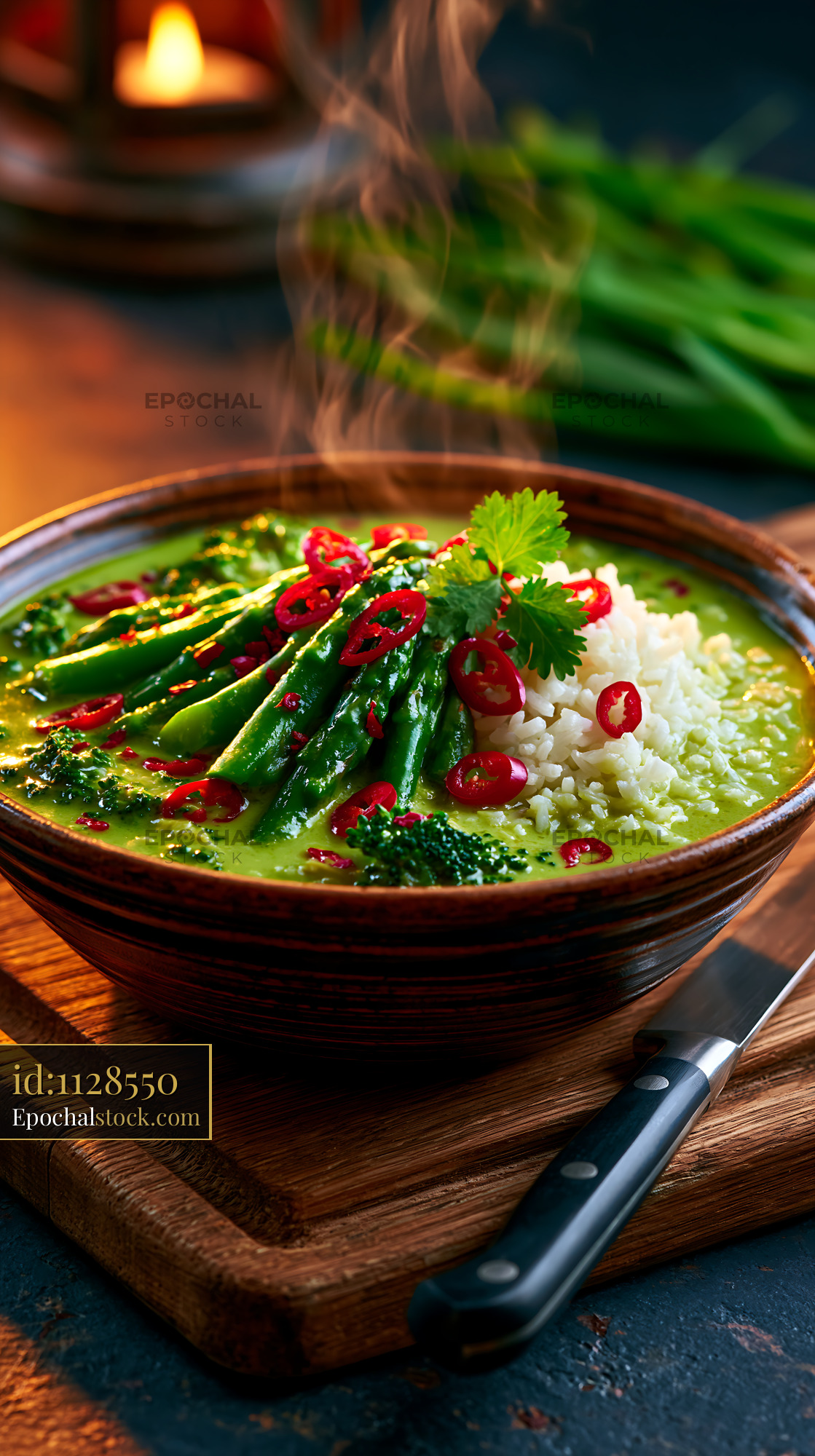 Watermarked full-resolution preview of Warm bowl of green curry with vegetables and rice