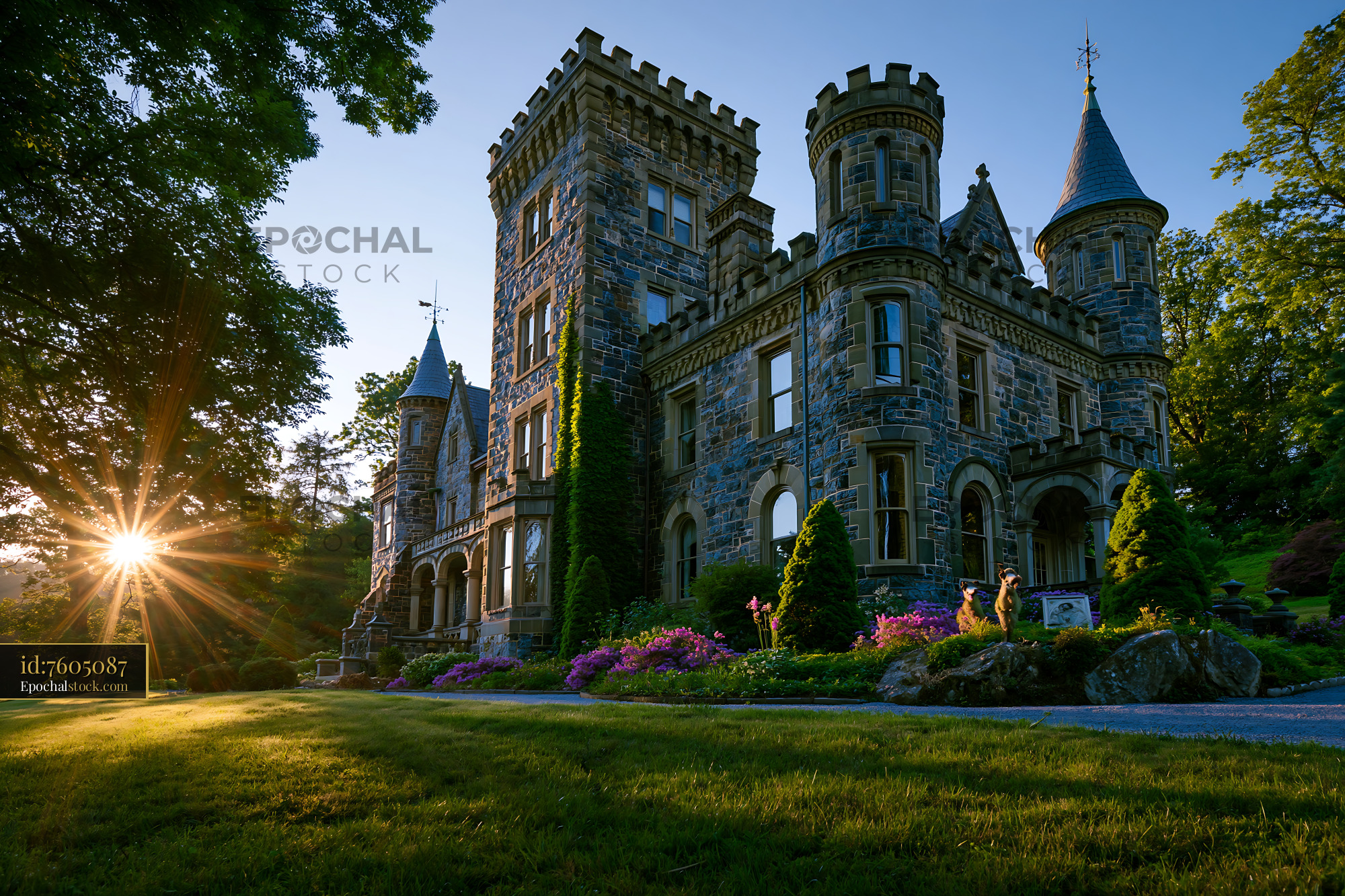 Watermarked full-resolution preview of Sunlight shining on a historic stone castle during sunset