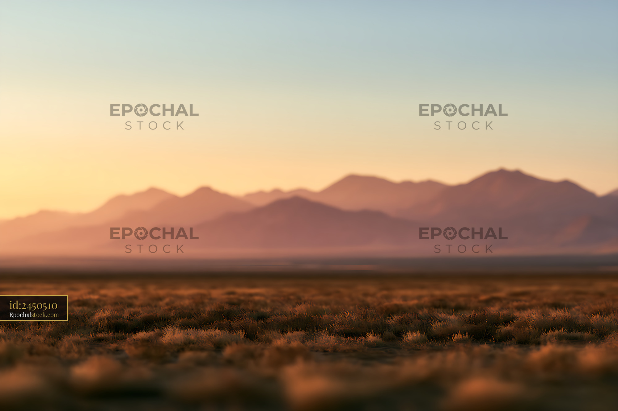 Watermarked full-resolution preview of Warm Golden-Hour Mountains and Dry Grassland