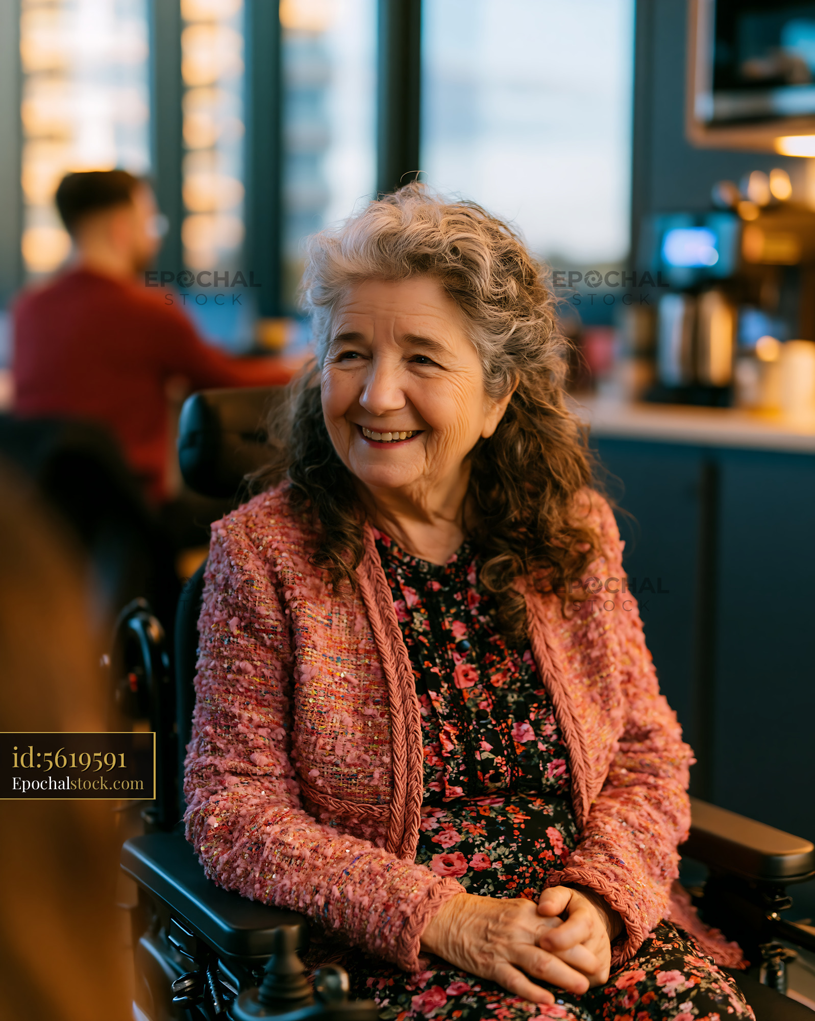 Watermarked full-resolution preview of Woman in wheelchair smiling in a modern café setting