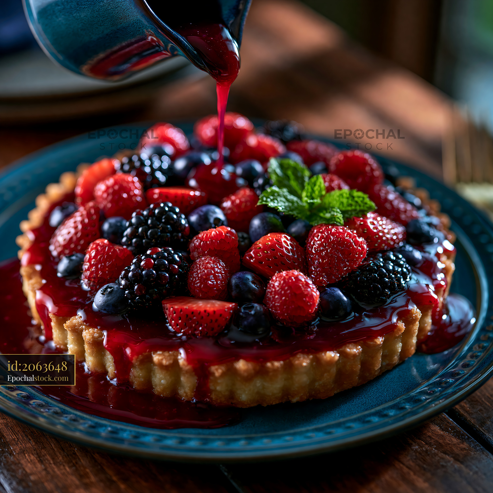 Watermarked full-resolution preview of Berry tart with assorted fruits on a wooden table