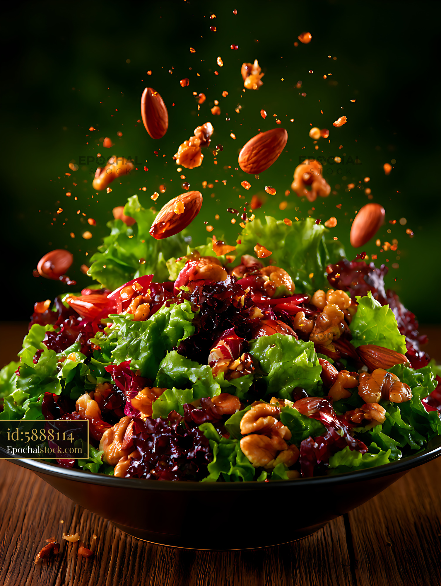 Watermarked full-resolution preview of Fresh green salad with nuts and ingredients in motion