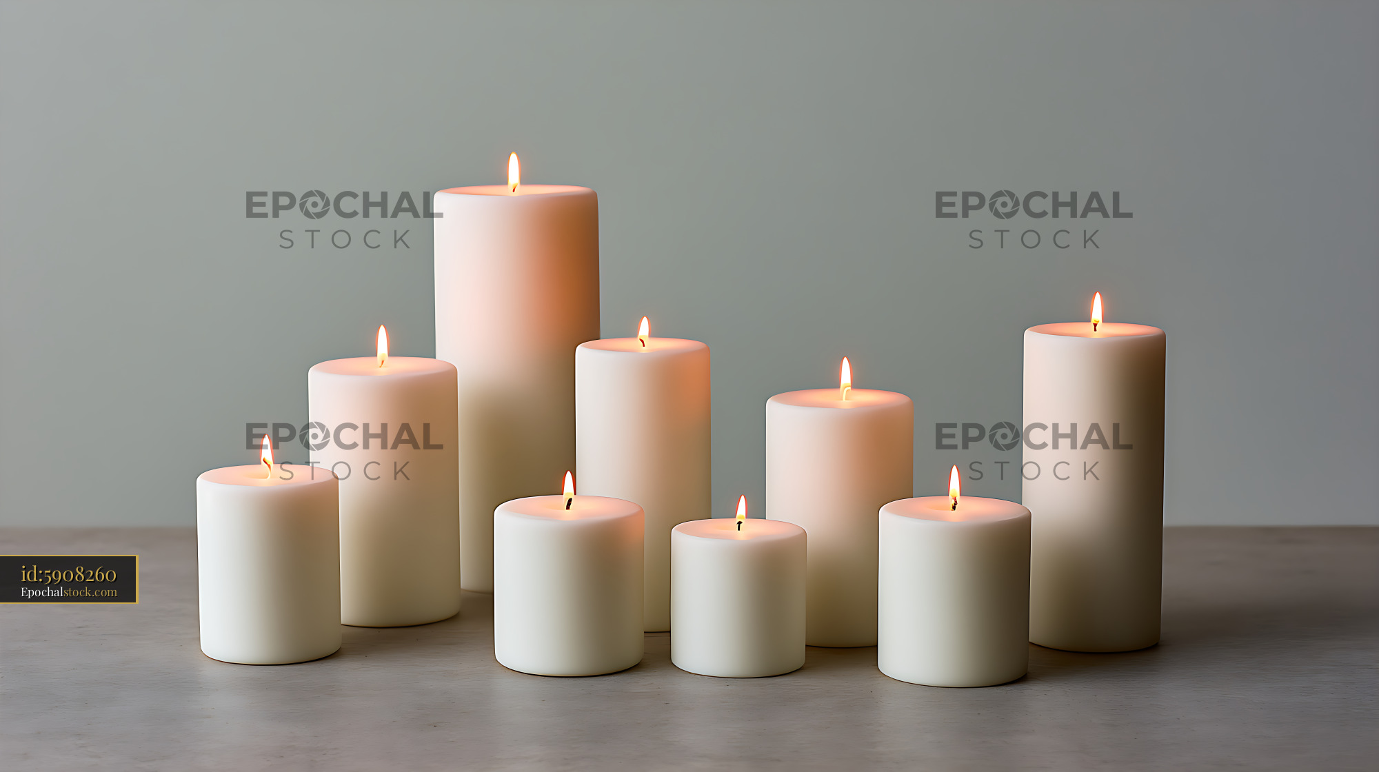 Watermarked full-resolution preview of Nine glowing white pillar candles arranged on a table