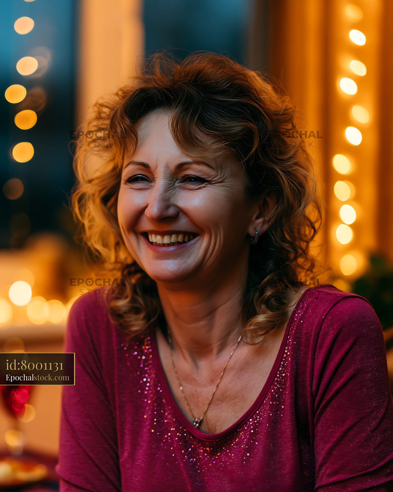 Woman Smiling in Cozy Indoor Setting With Warm Lights - stock photo
