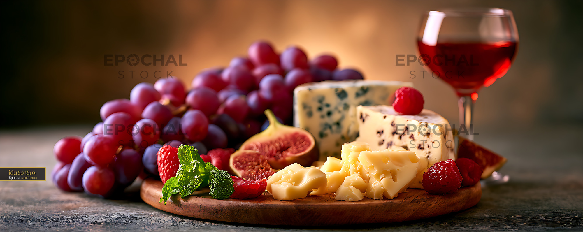 Watermarked full-resolution preview of Gourmet cheese platter with fruit and wine