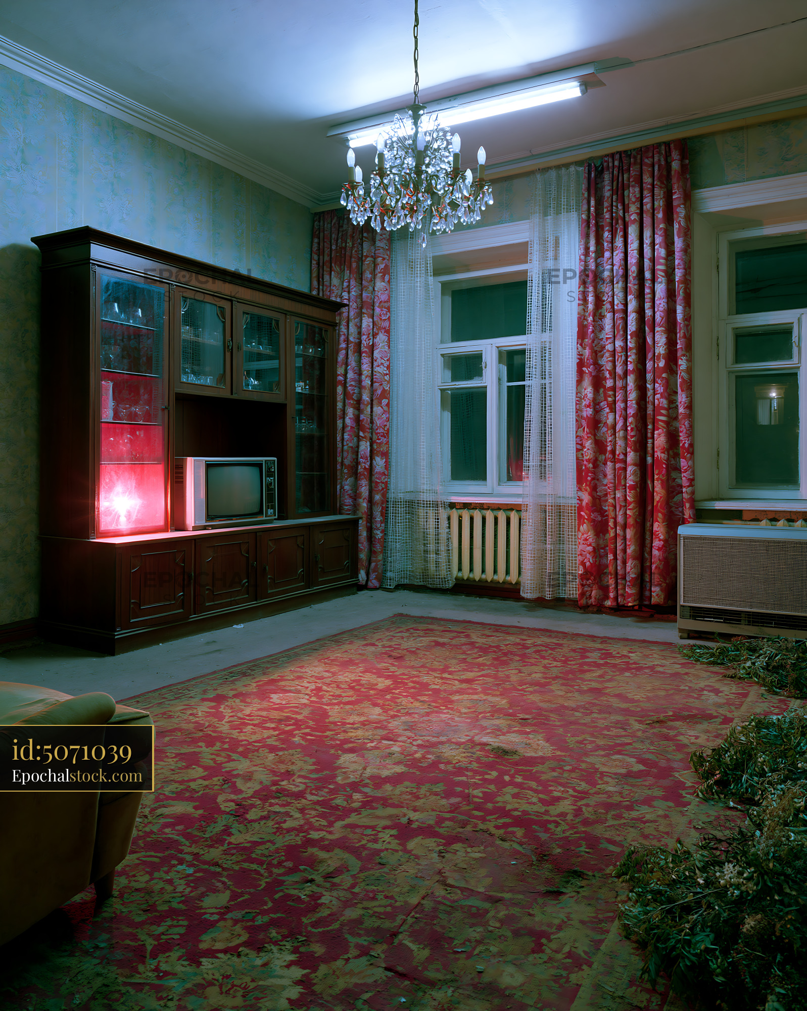 Watermarked full-resolution preview of Old living room with vintage furniture and colorful curtains