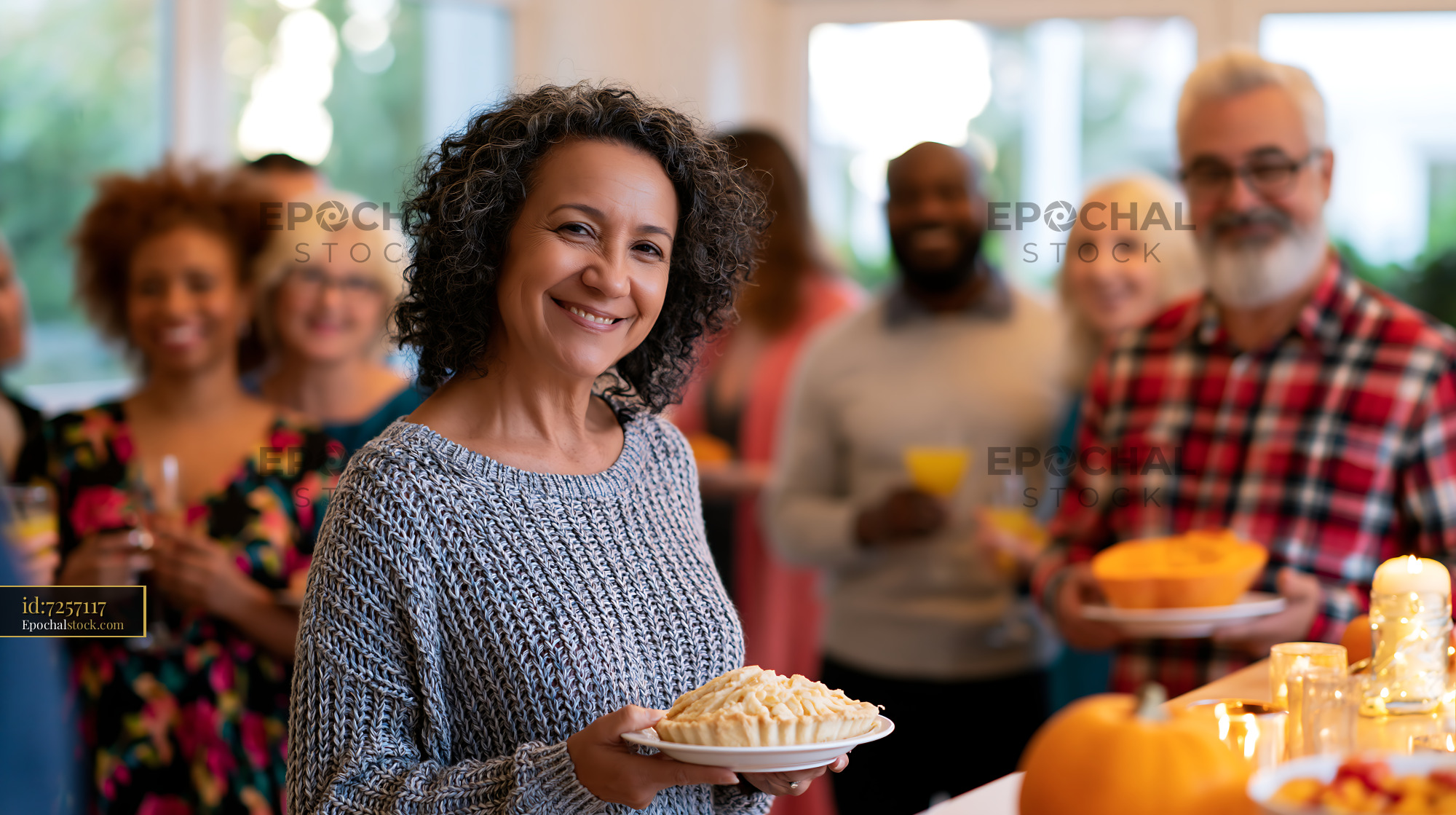 Watermarked full-resolution preview of Gathering of friends sharing food and drinks at a home celebration