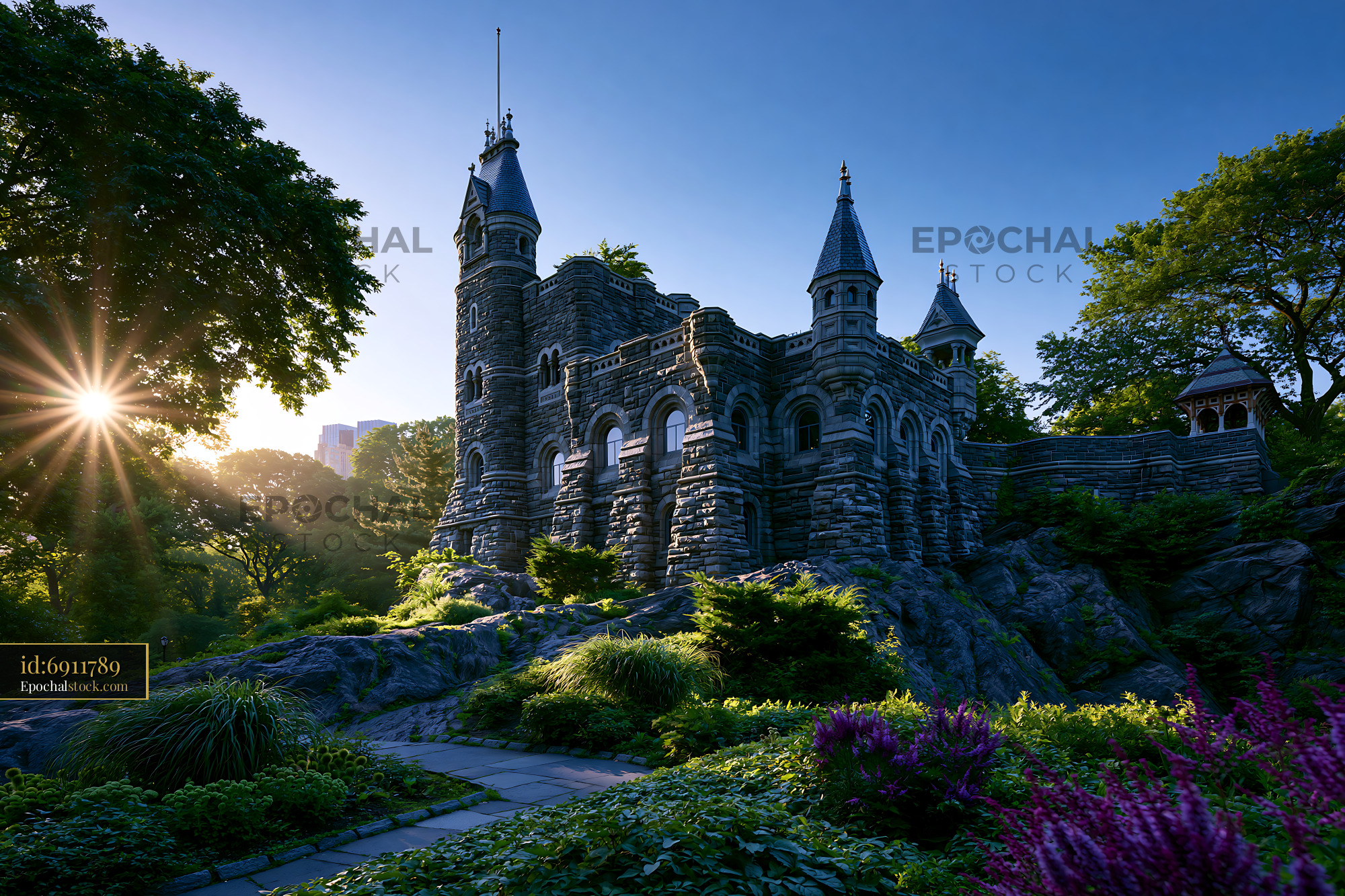 Watermarked full-resolution preview of Stone castle surrounded by trees and flowers at sunset