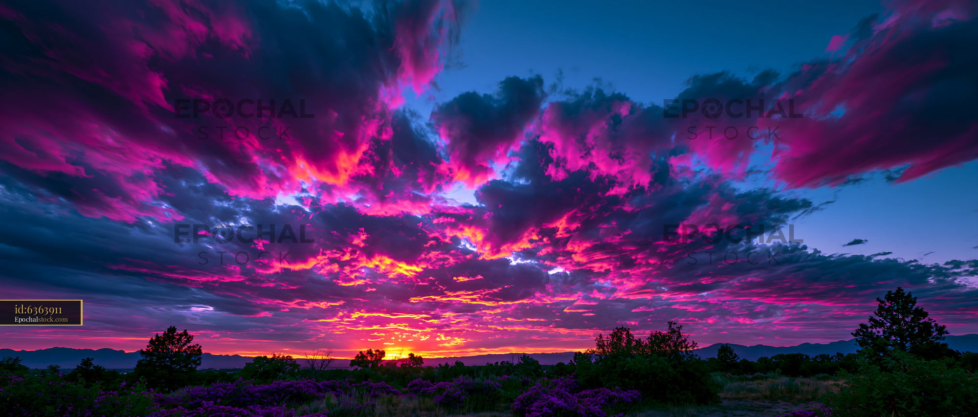 Watermarked full-resolution preview of Colorful sunset with clouds in a rural landscape