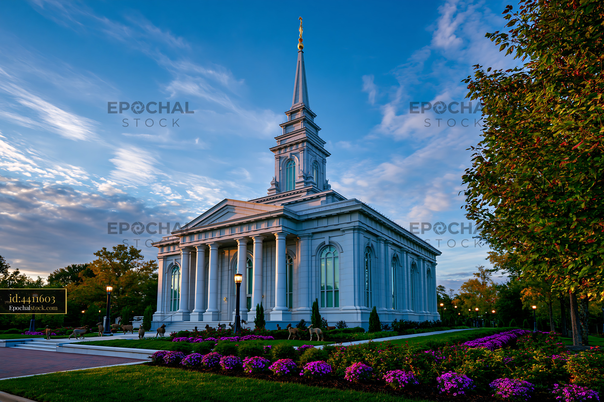 Watermarked full-resolution preview of Building with tall spire and columns in a public park setting
