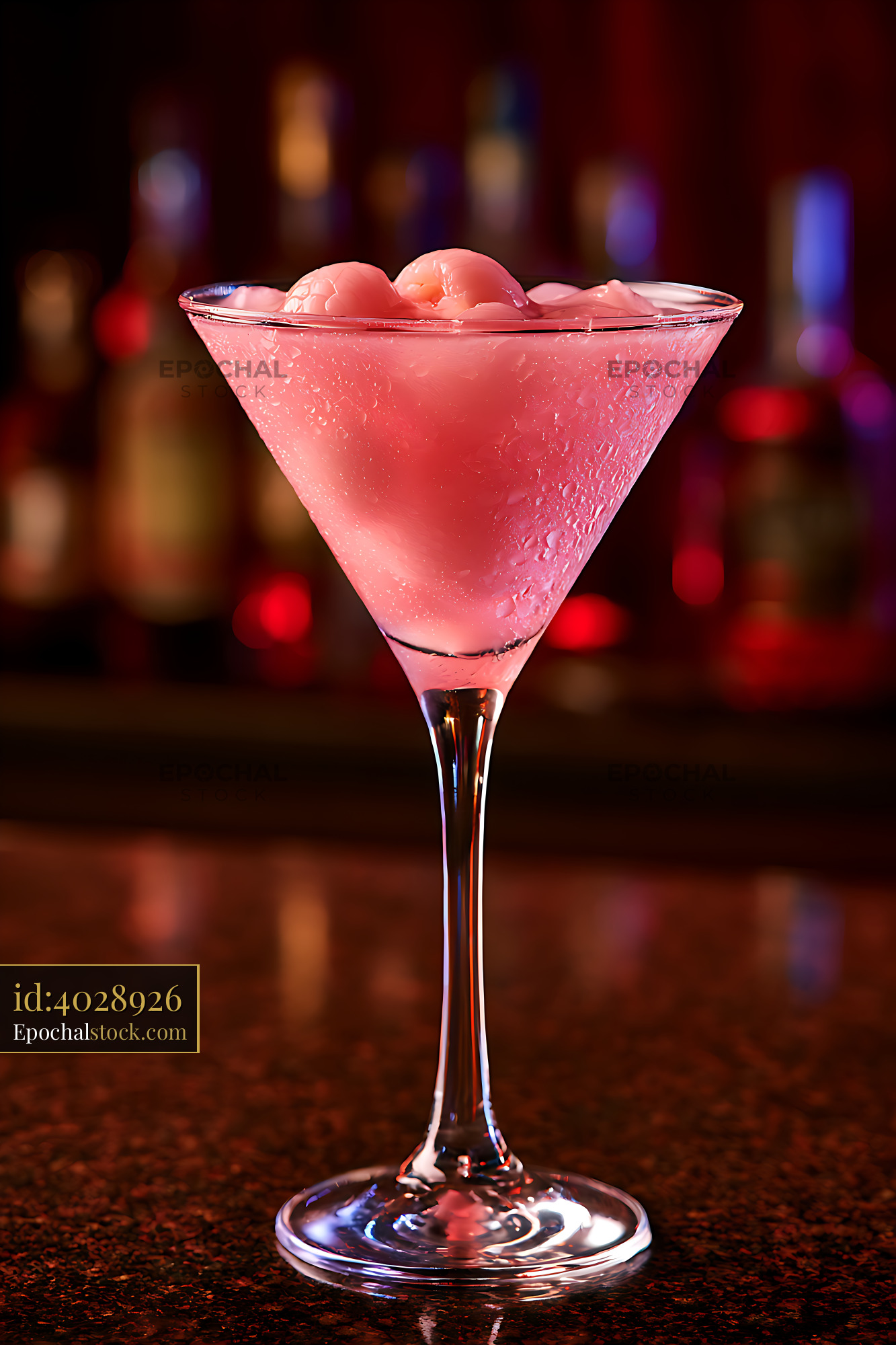 Watermarked full-resolution preview of Chilled pink drink in martini glass against colorful blurred lights