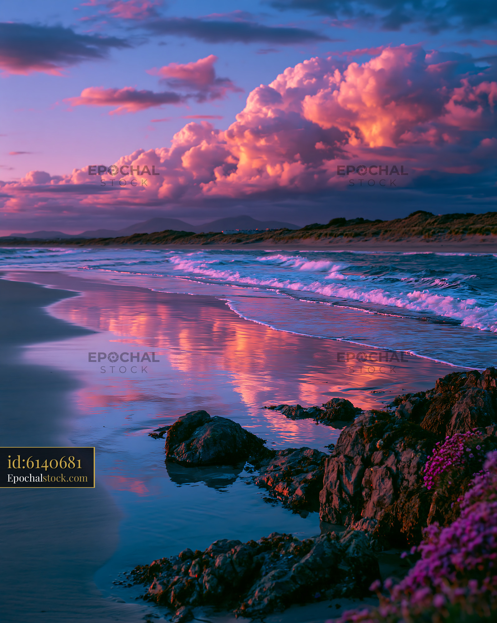 Watermarked full-resolution preview of Sunset over the ocean with clouds and rocks along the shore