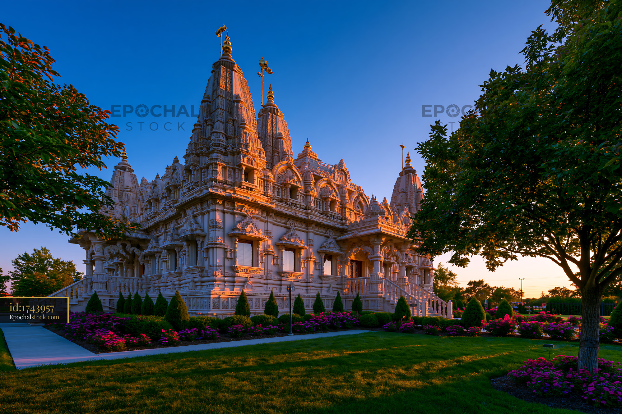 BAPS Temple in Detroit, USA at Sunset With Colorful Flowers - stock photo