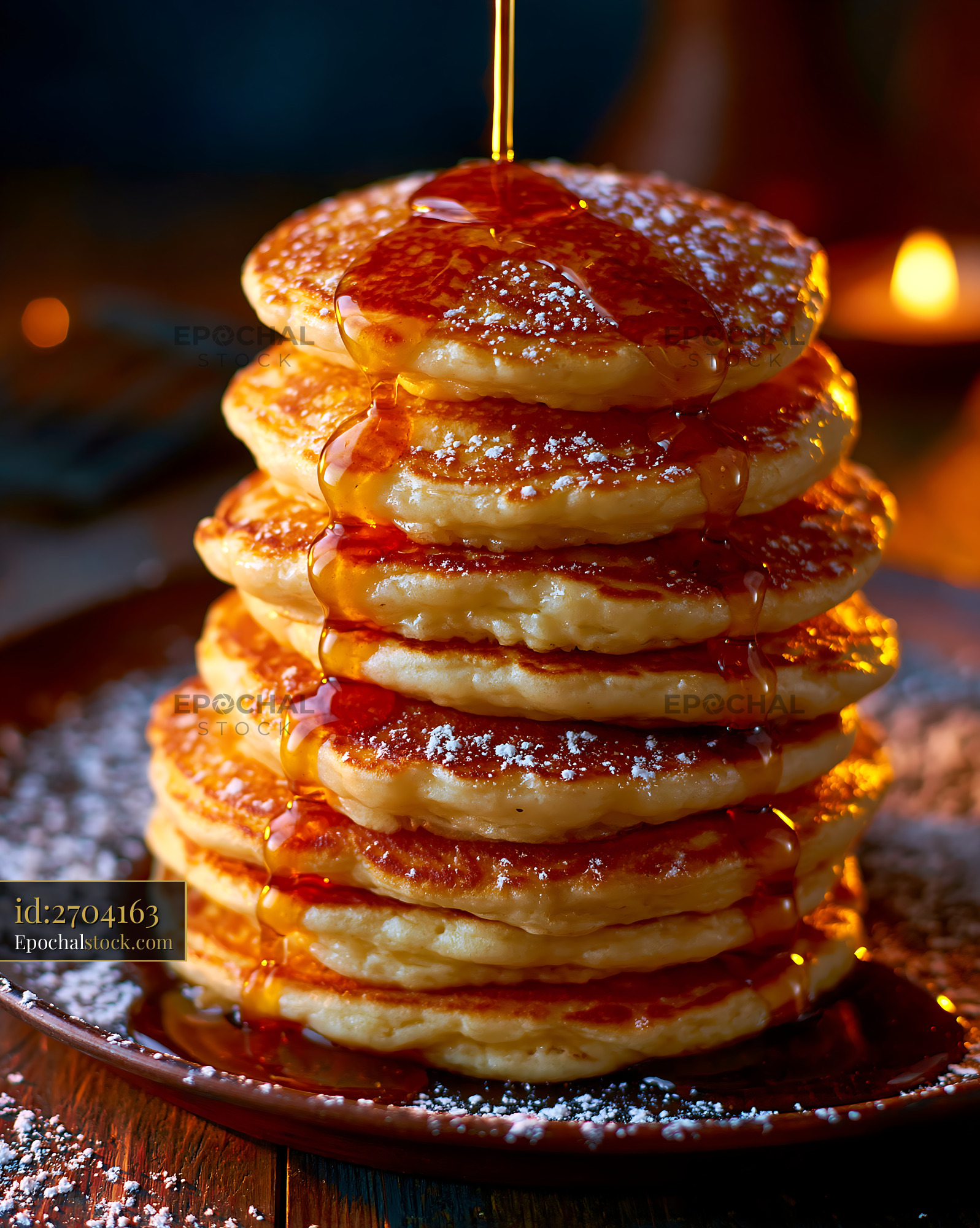 Watermarked full-resolution preview of Golden pancake stack drizzled with syrup
