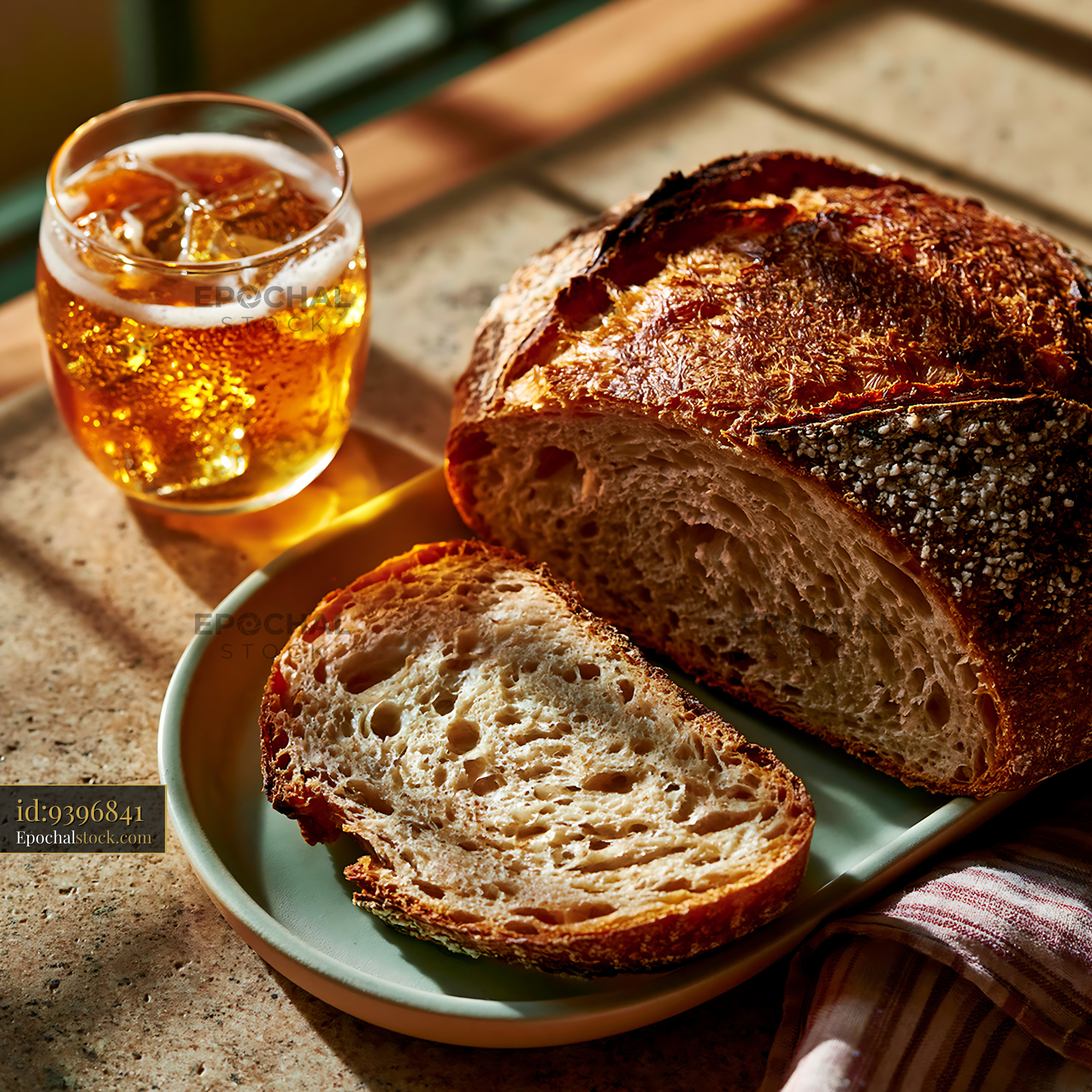 Watermarked full-resolution preview of Fresh bread and iced drink on a wooden table