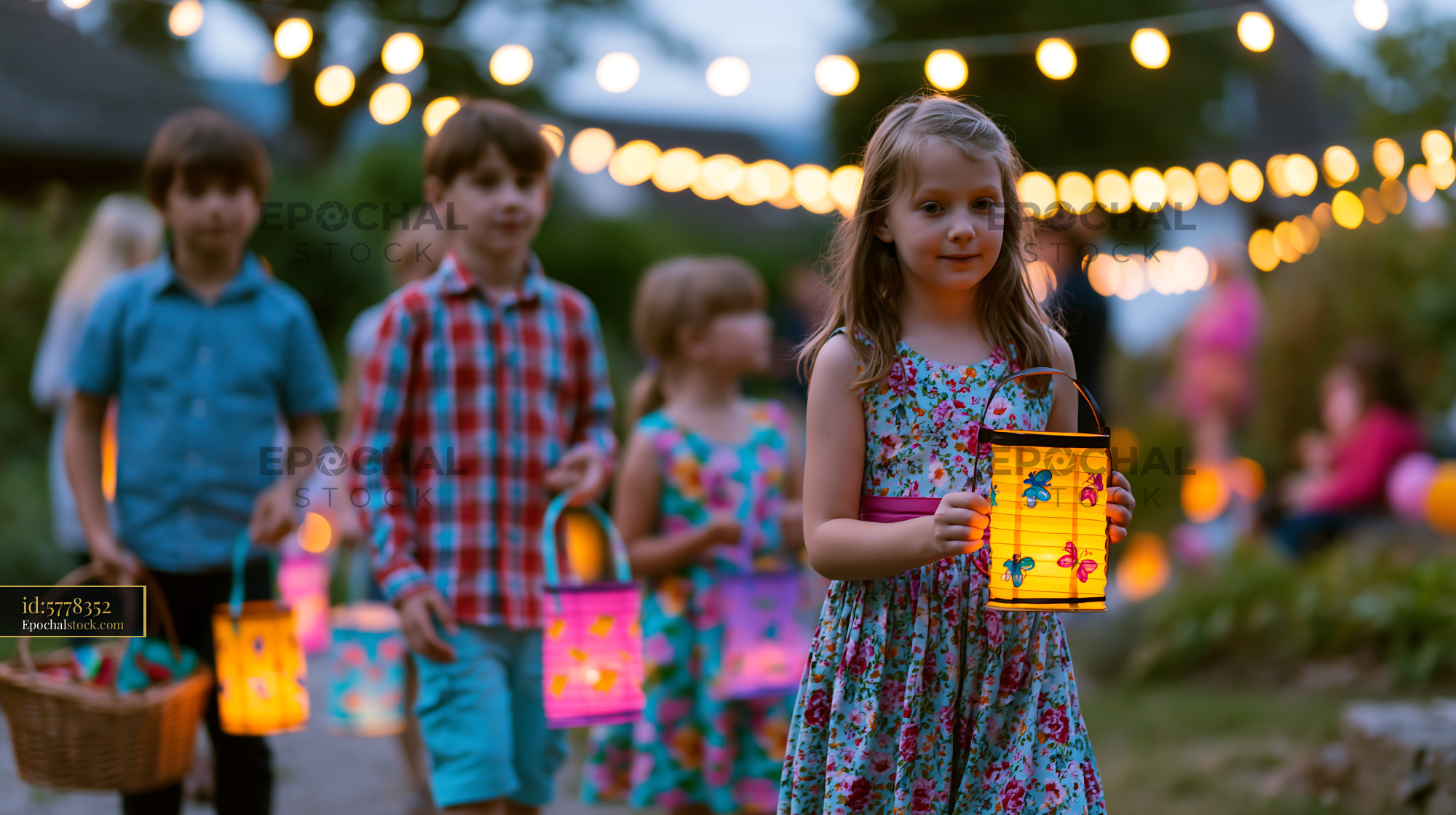 Watermarked full-resolution preview of Children walk with lanterns during an outdoor summer evening event