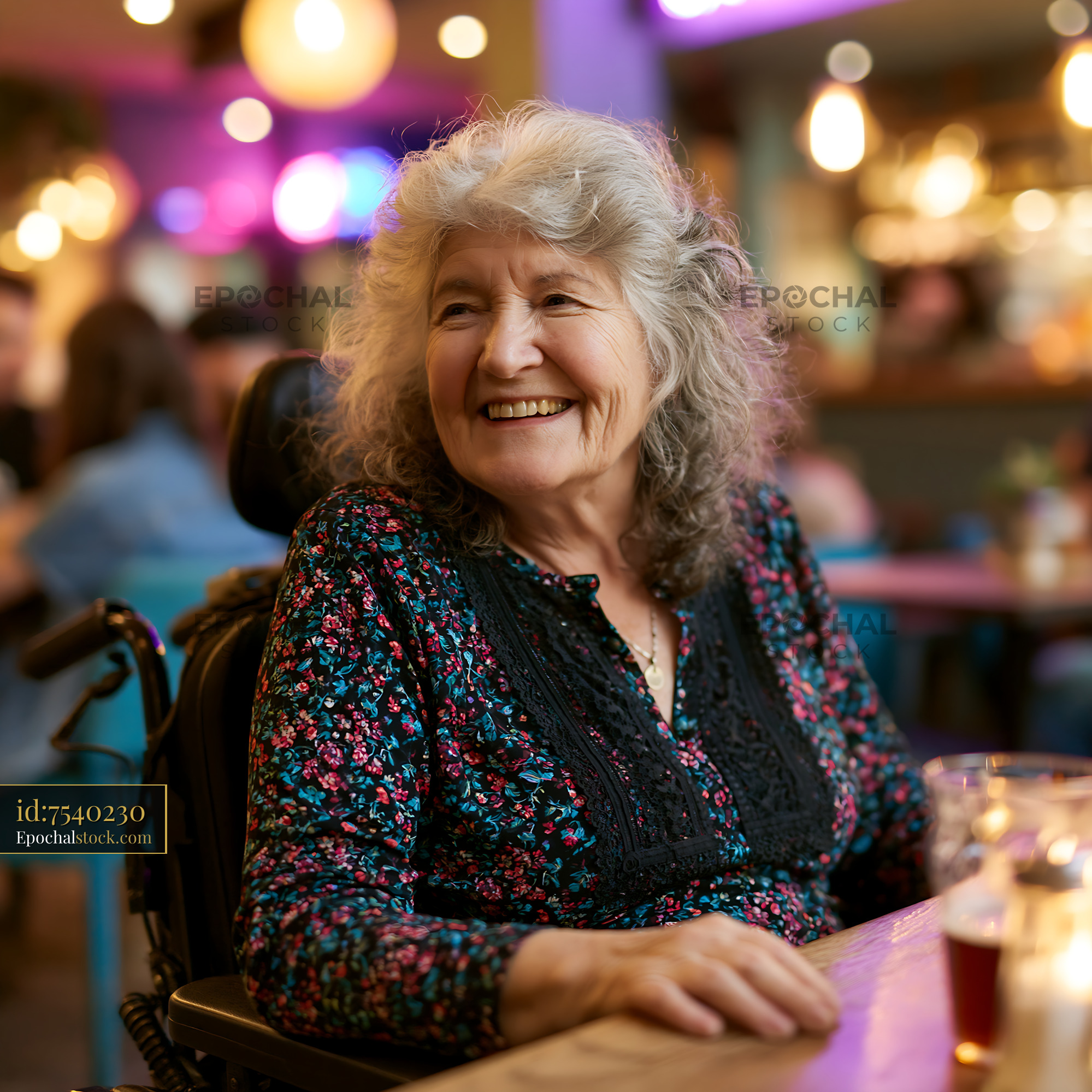 Watermarked full-resolution preview of Smiling woman in a wheelchair at a busy cafe