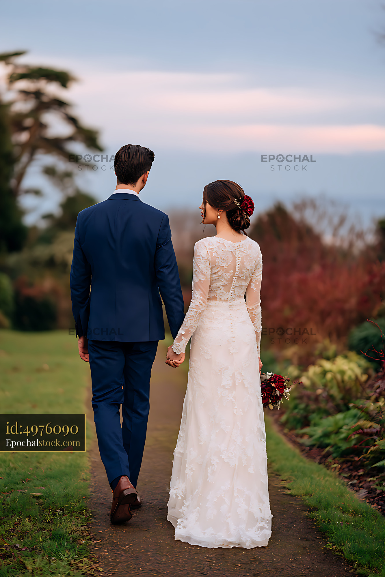 Watermarked full-resolution preview of Bride and groom walking together through a landscaped garden