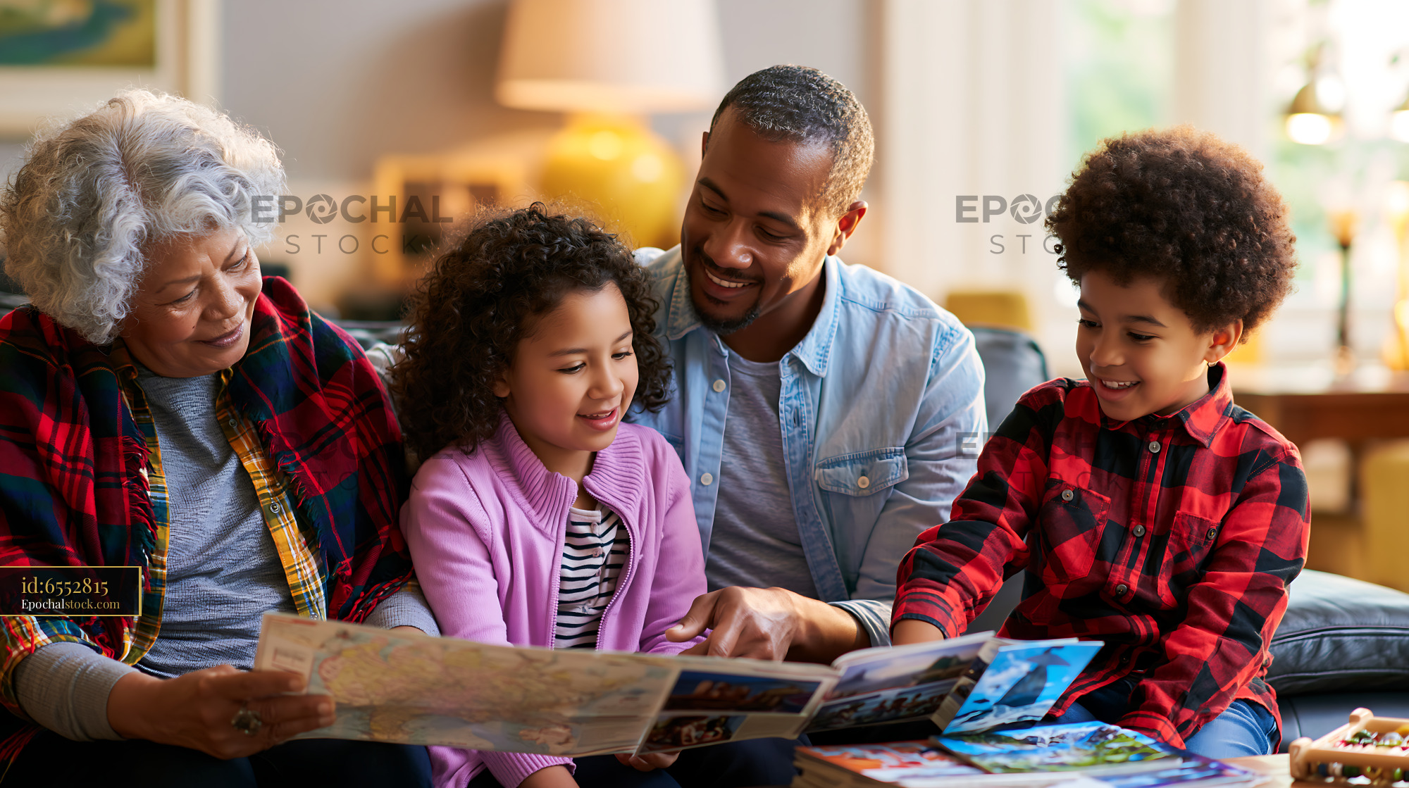 Watermarked full-resolution preview of Family enjoying time together while looking at travel maps