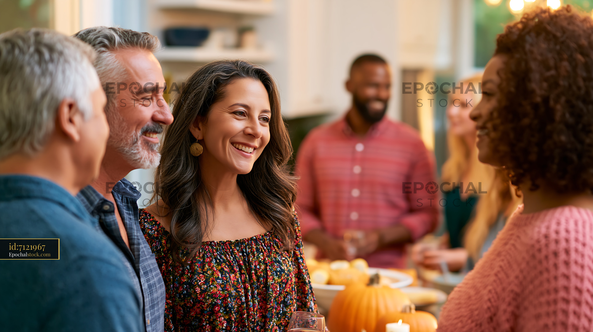 Watermarked full-resolution preview of Friends gather for a festive celebration in a cozy kitchen