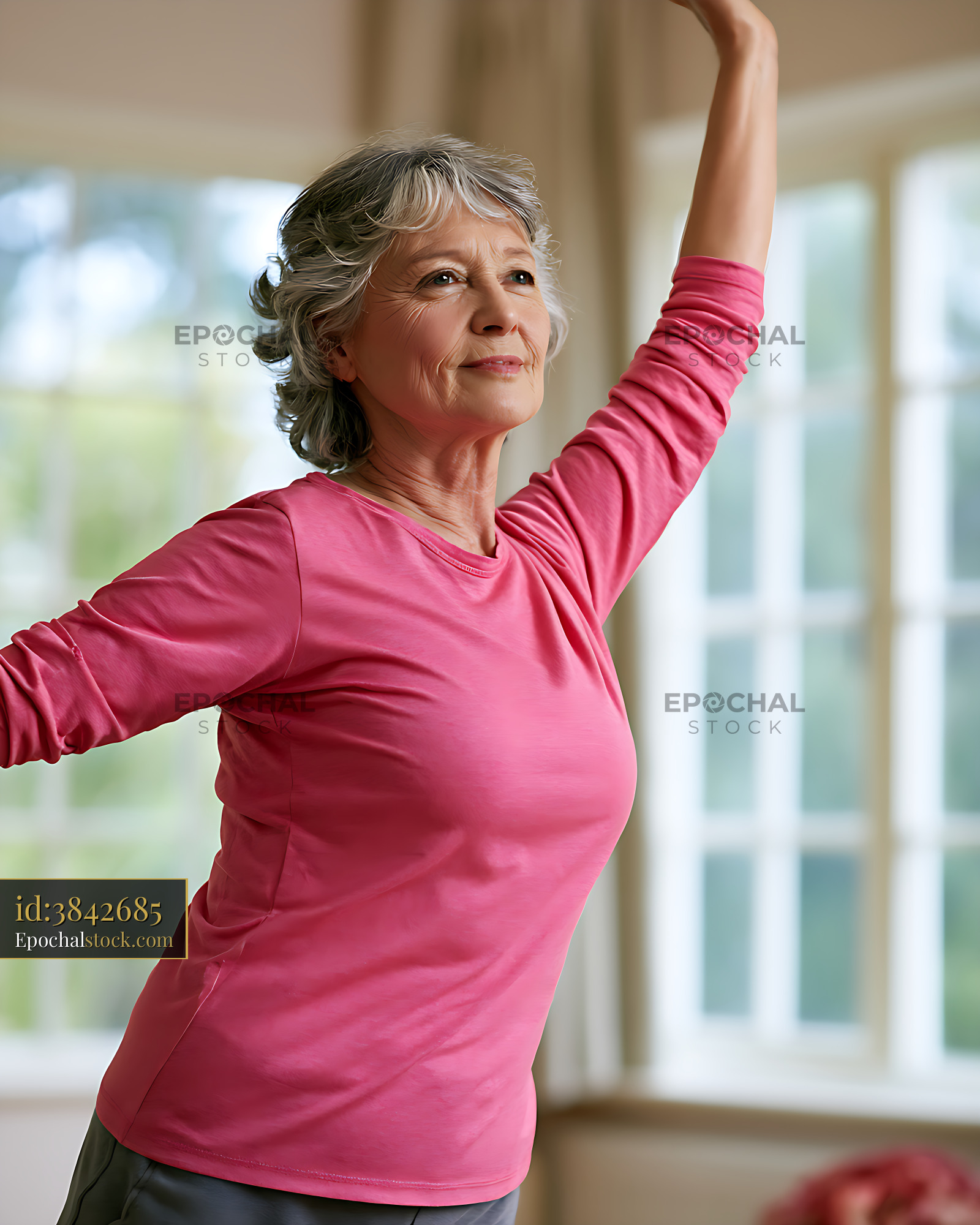 Watermarked full-resolution preview of Senior woman doing an indoor stretch