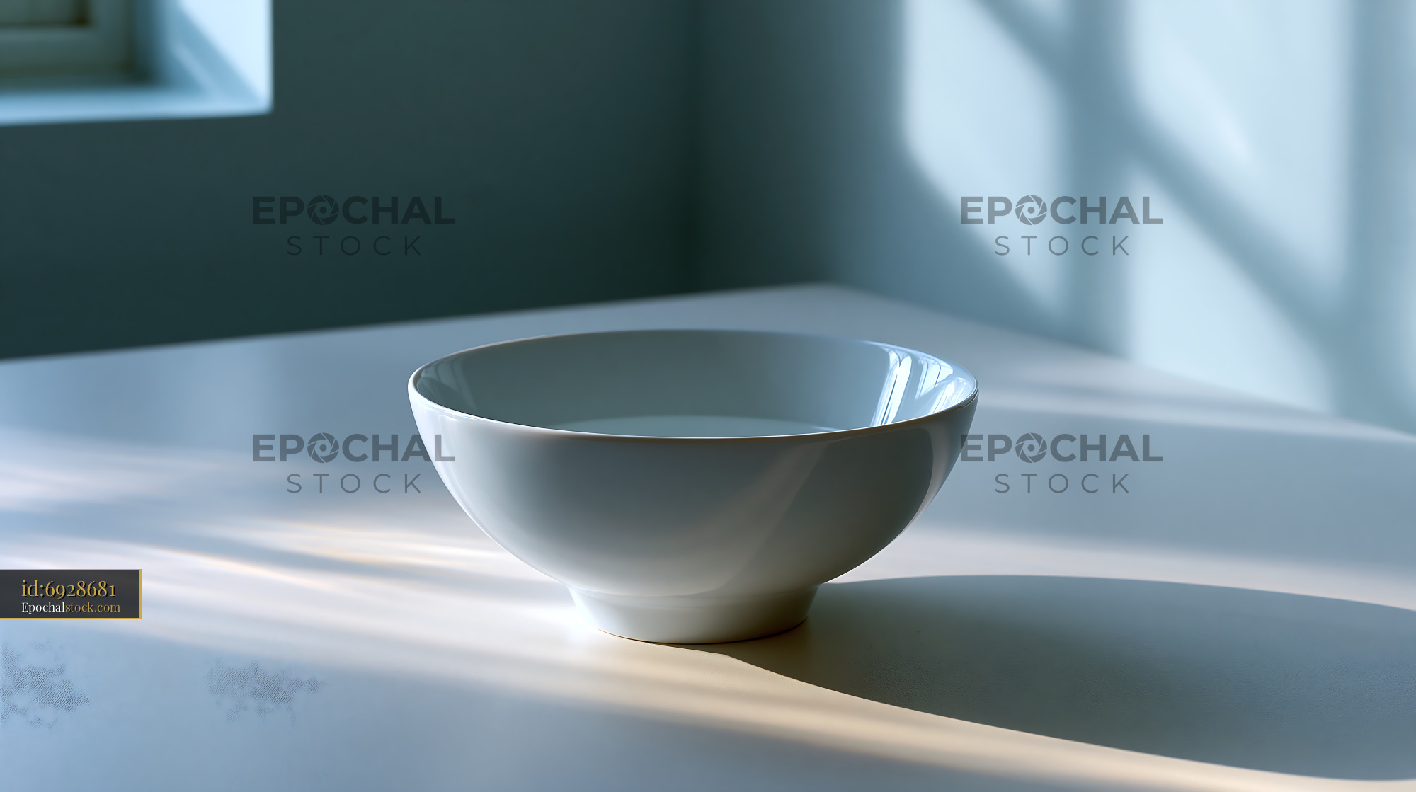 Watermarked full-resolution preview of Sunlit white ceramic bowl on a tabletop