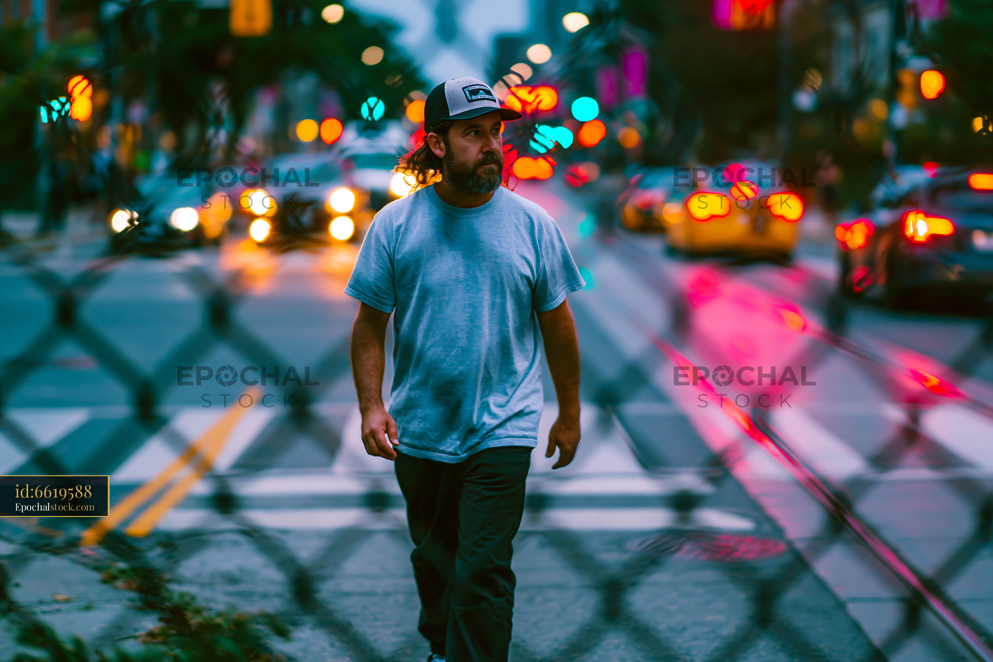 Watermarked full-resolution preview of Man walks along the street in the city during evening hours